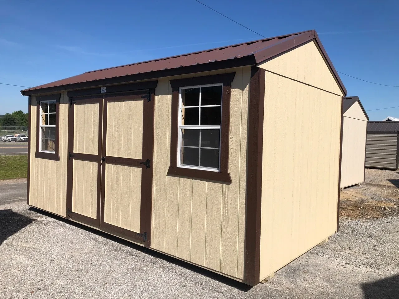 exterior of 8x16 garden shed showing double doors and 2 windows