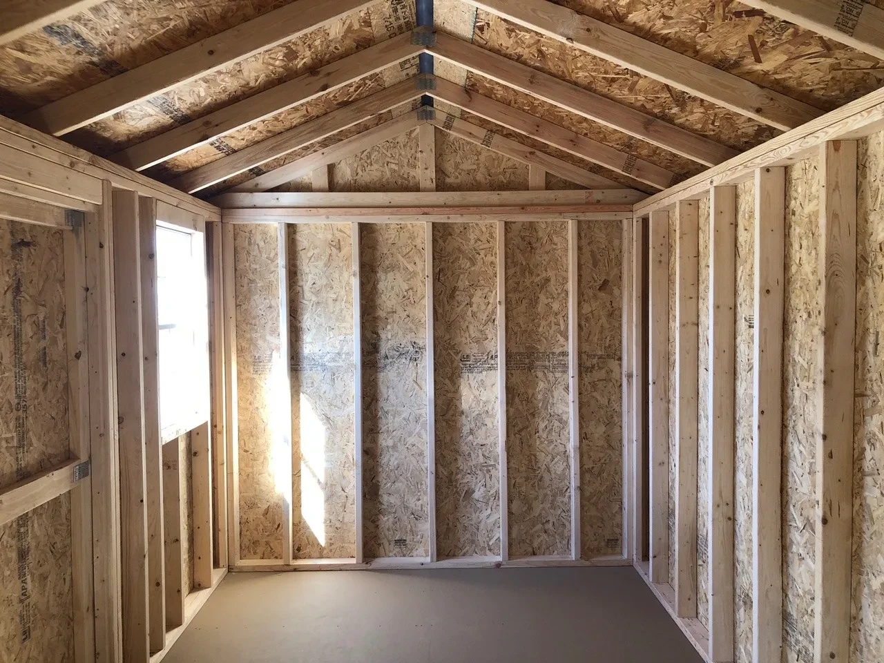 interior of 8x16 garden shed showing the floor and 1 window