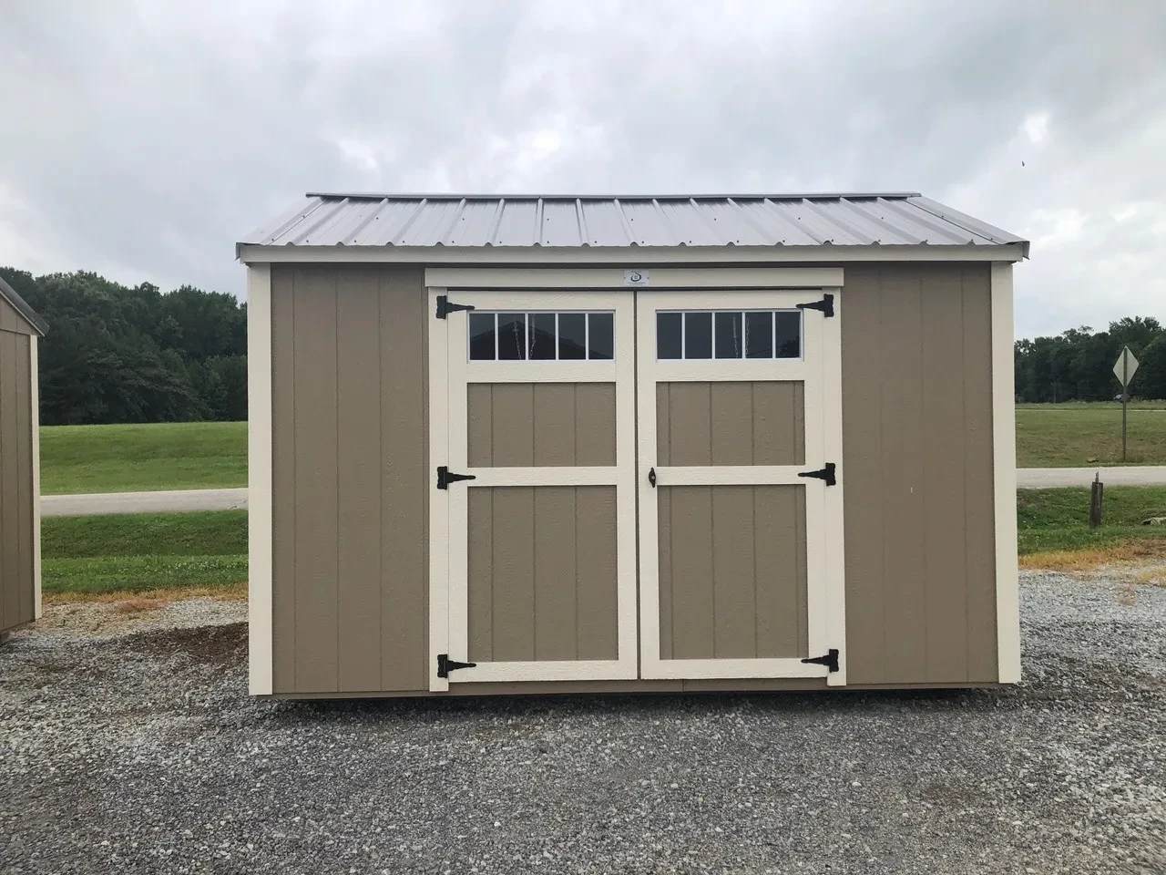 exterior of 8x12 garden shed showing the double doors with transoms