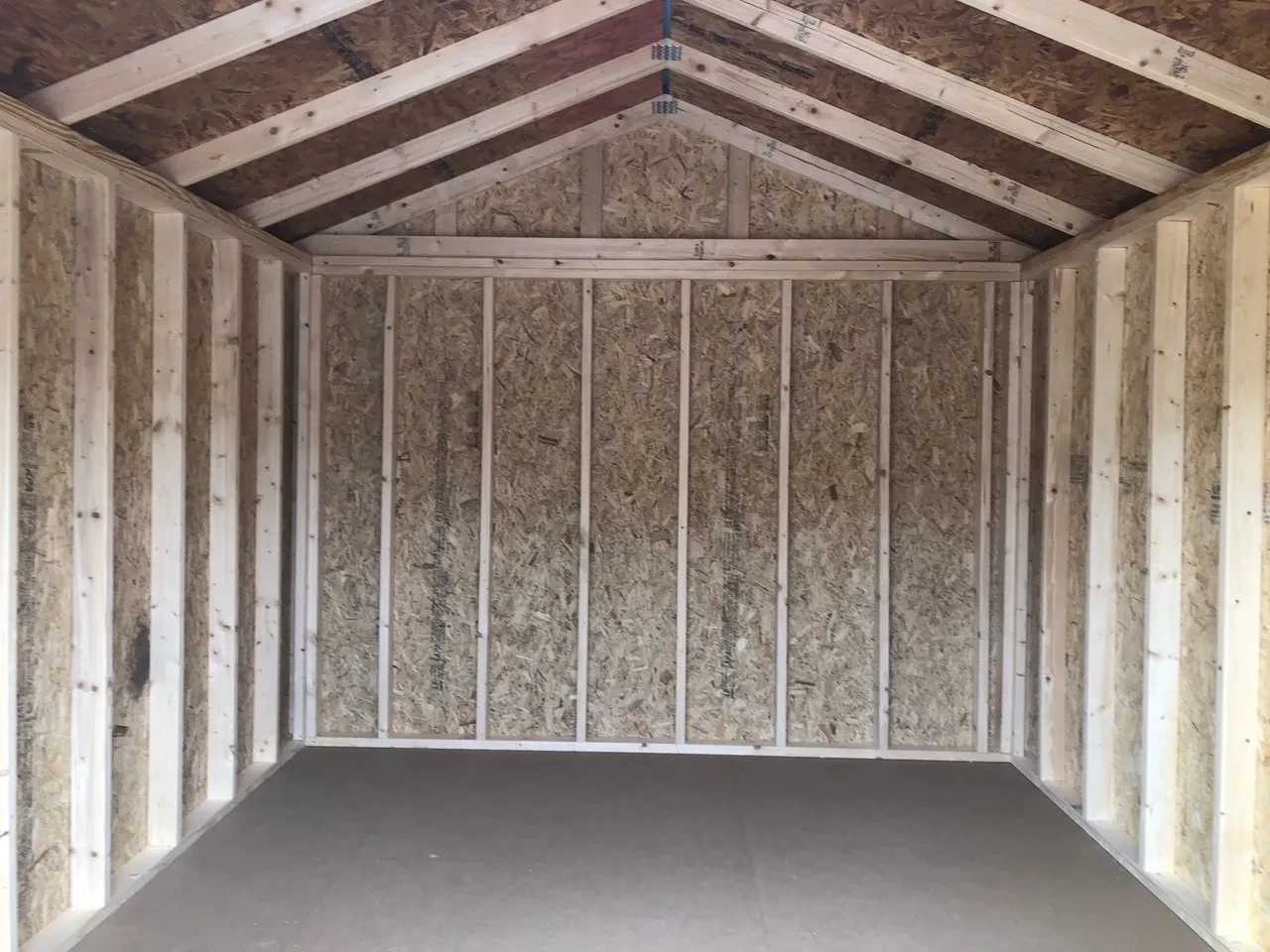 interior of 10x12 utility shed showing walls and floor