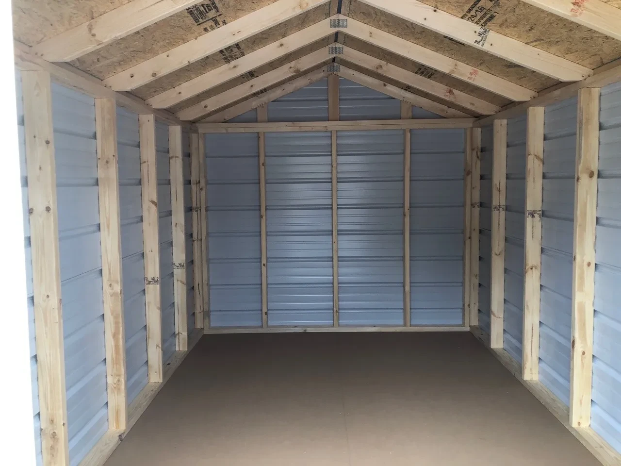 interior of 8x12 economy metal shed showing walls & floor