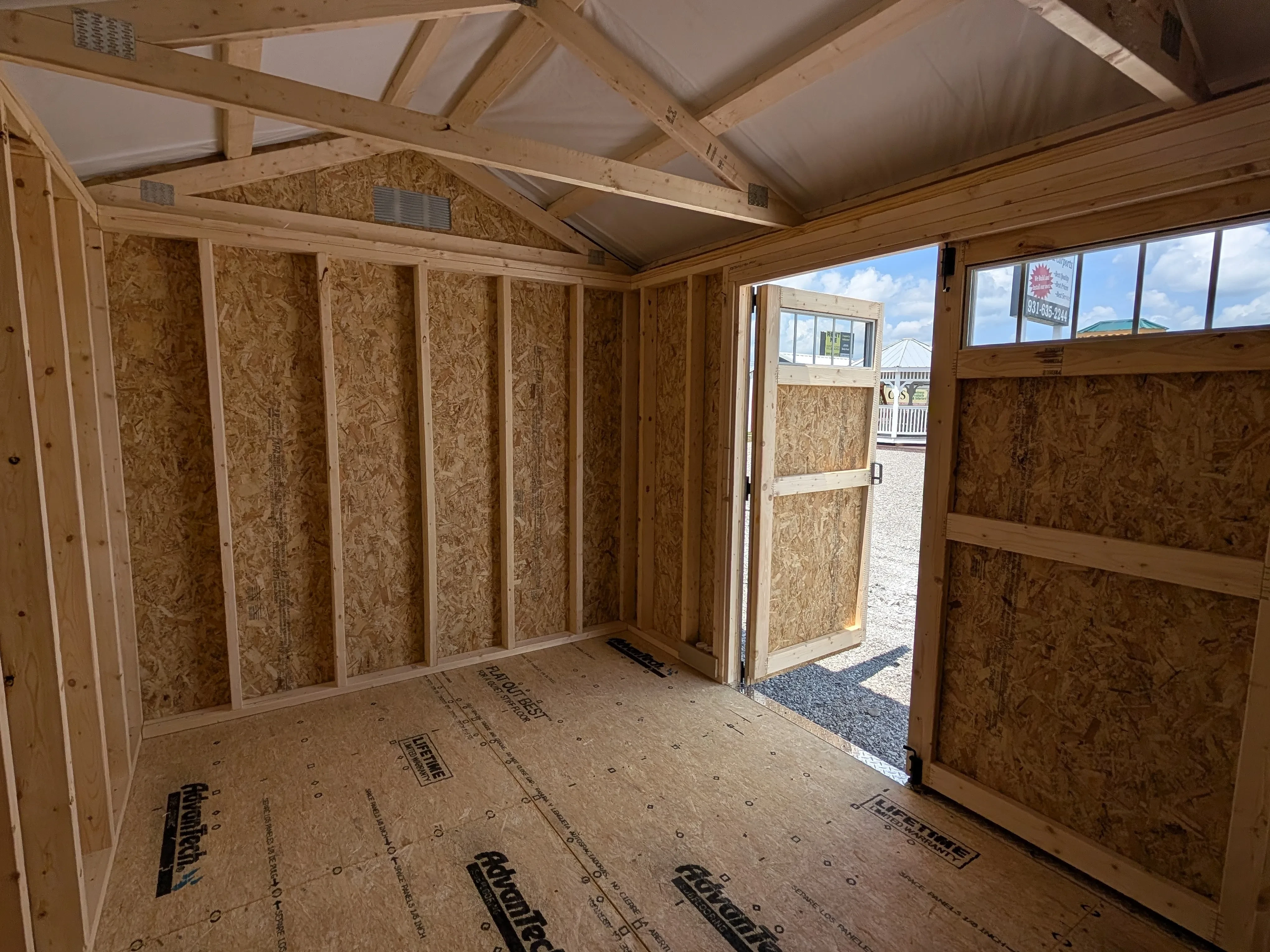 inside a wood garden shed looking at the front right corner