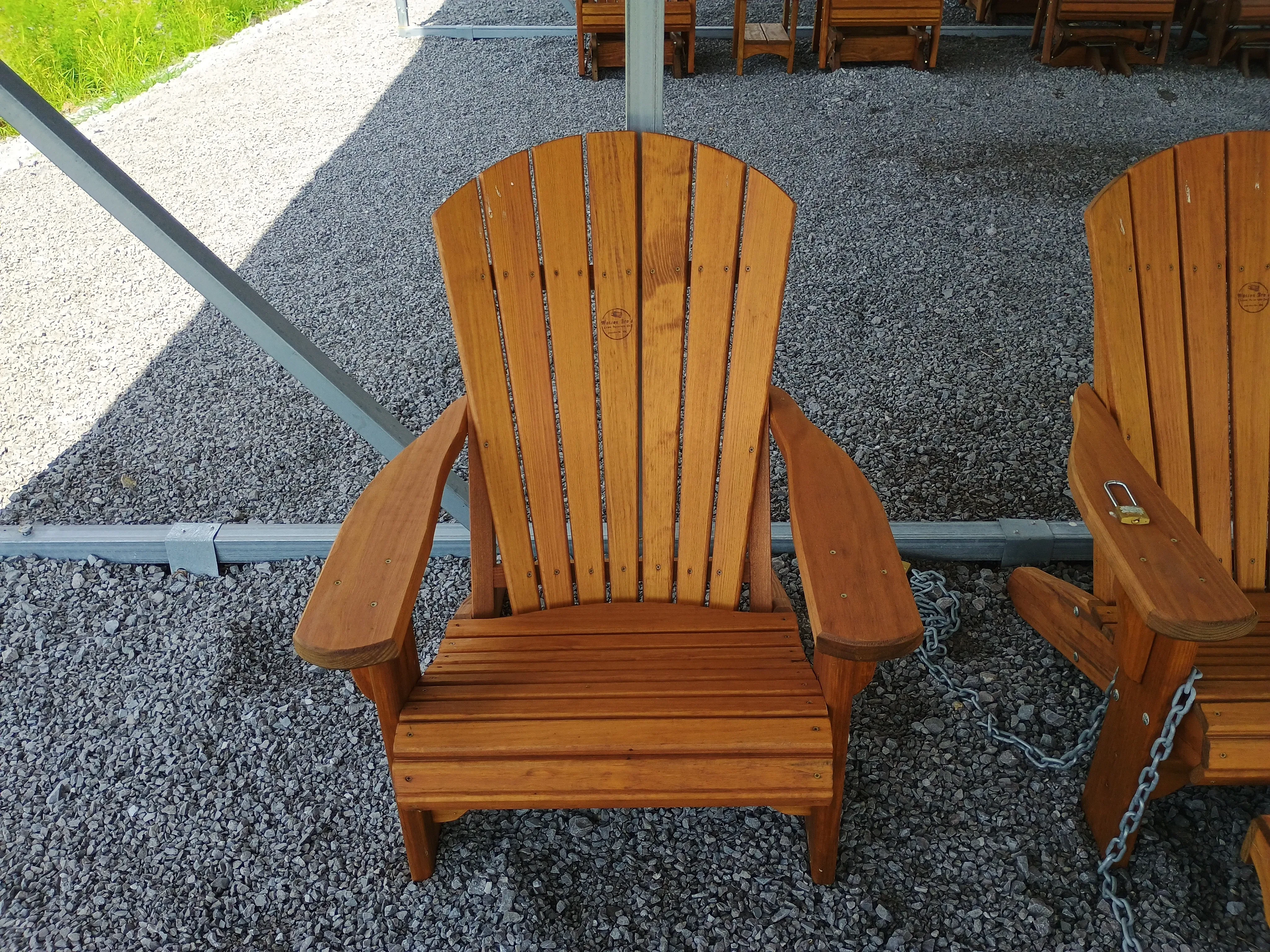 wood stained and sealed adirondack chair