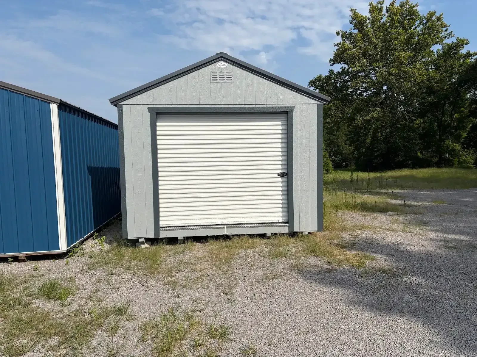 rollup garage door on the end of wood garage shed