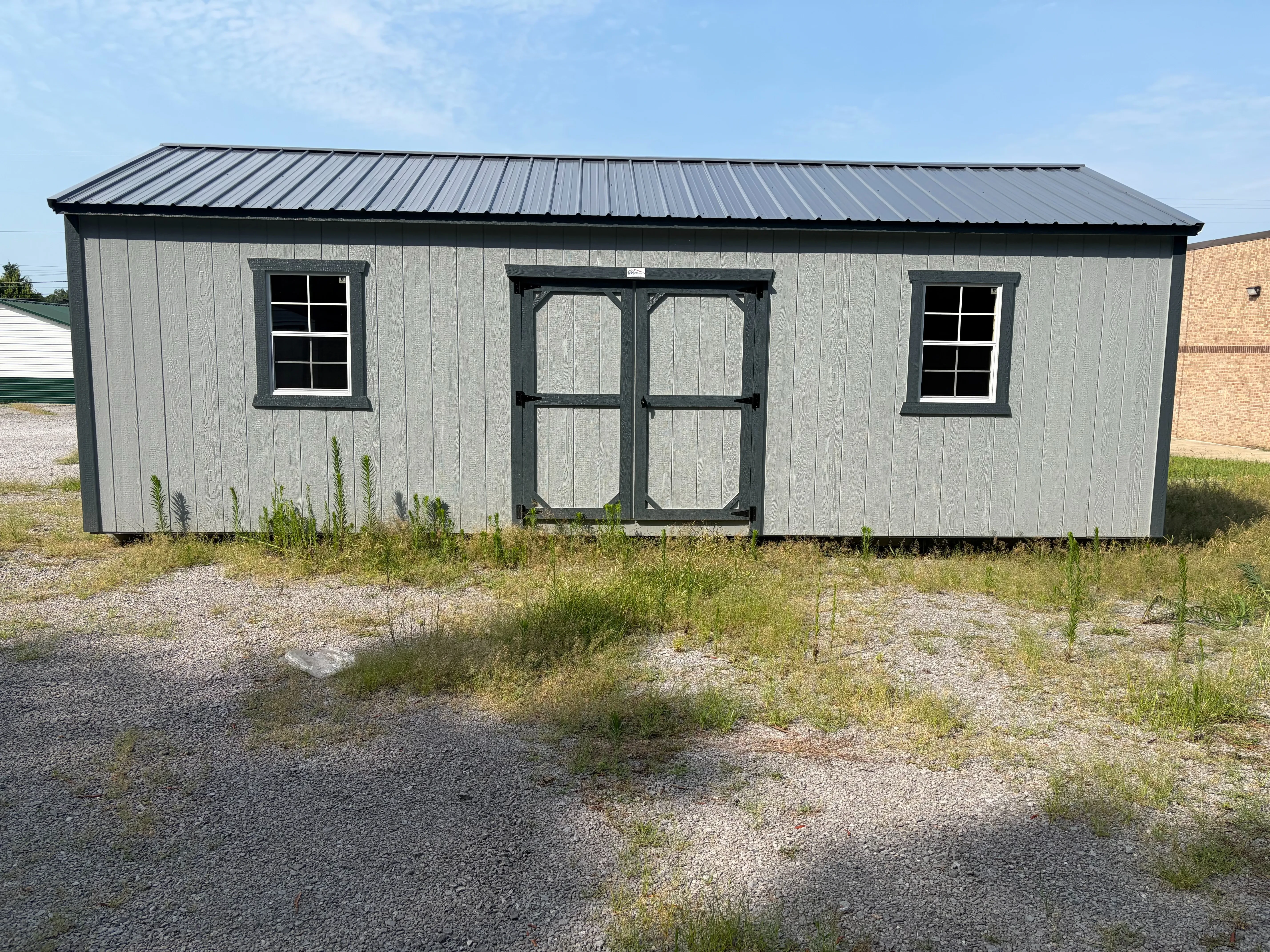 exterior wood garage, 2 x 6 floor joist 12" on center, double doors with window on each side