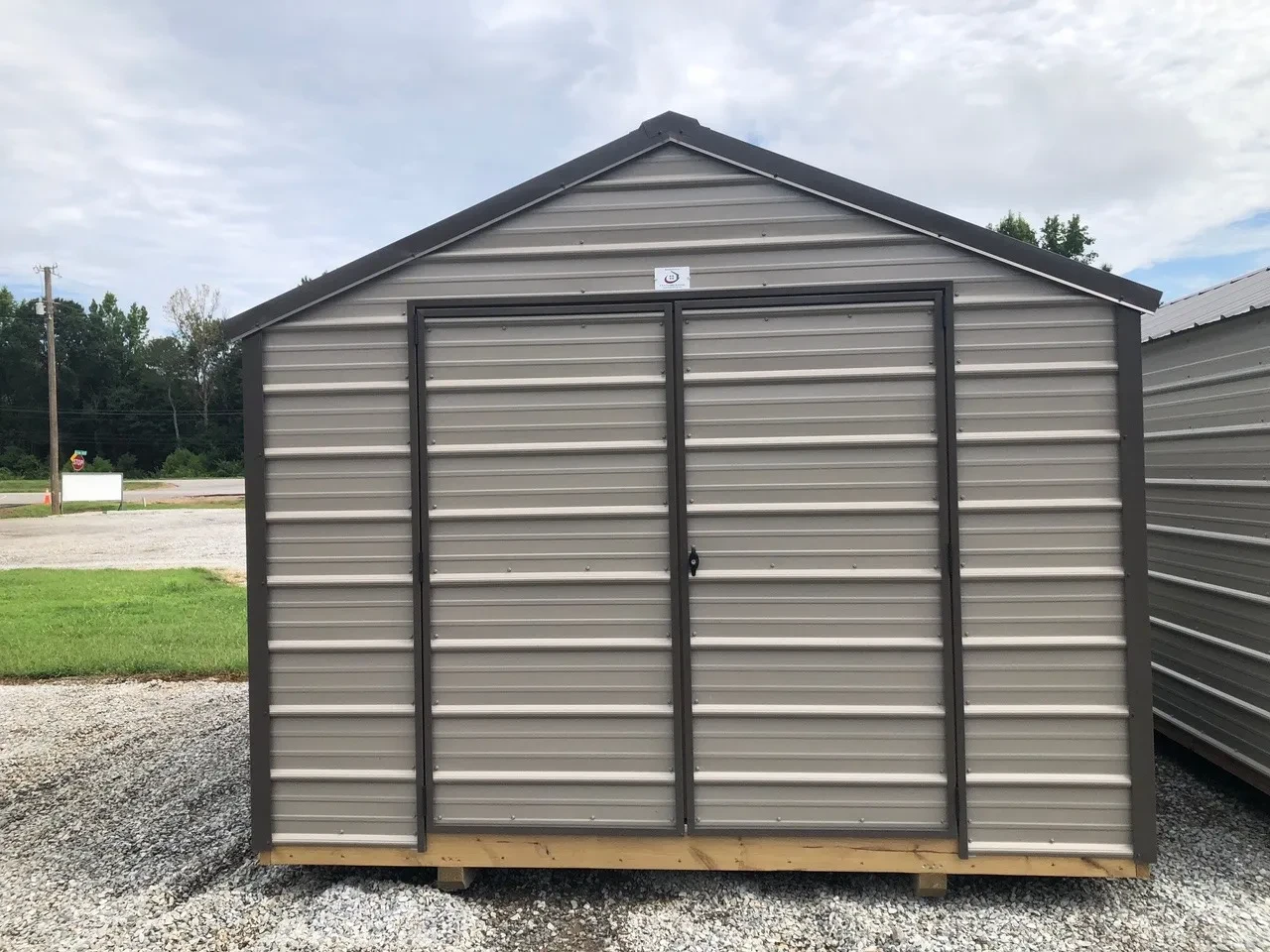 exterior of 10x12 metal utility shed showing double doors