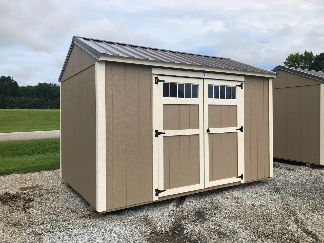 exterior of 8x12 garden shed showing double doors with transoms windows in doors