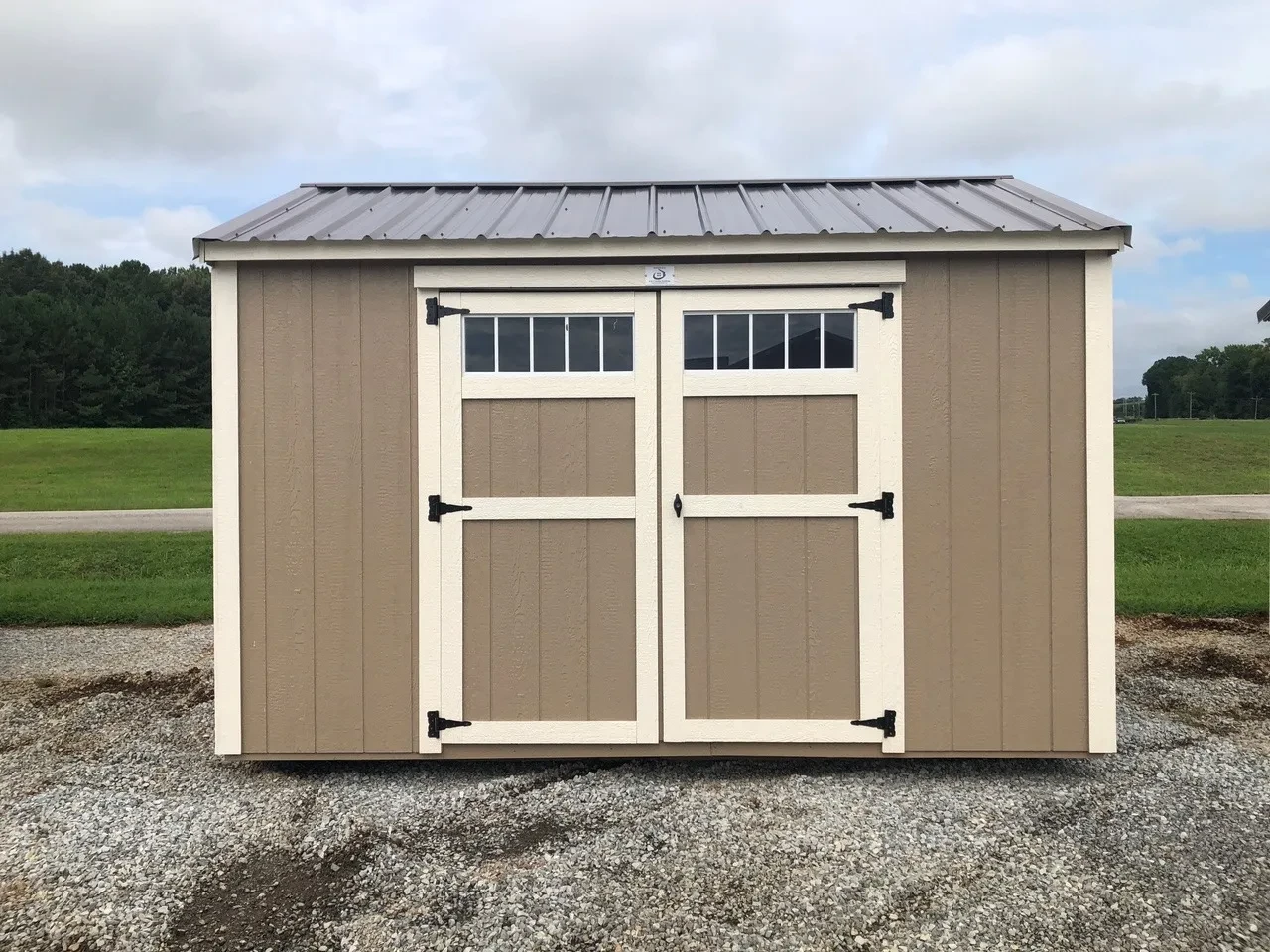 exterior of 8x12 garden shed showing double doors with transoms windows in doors