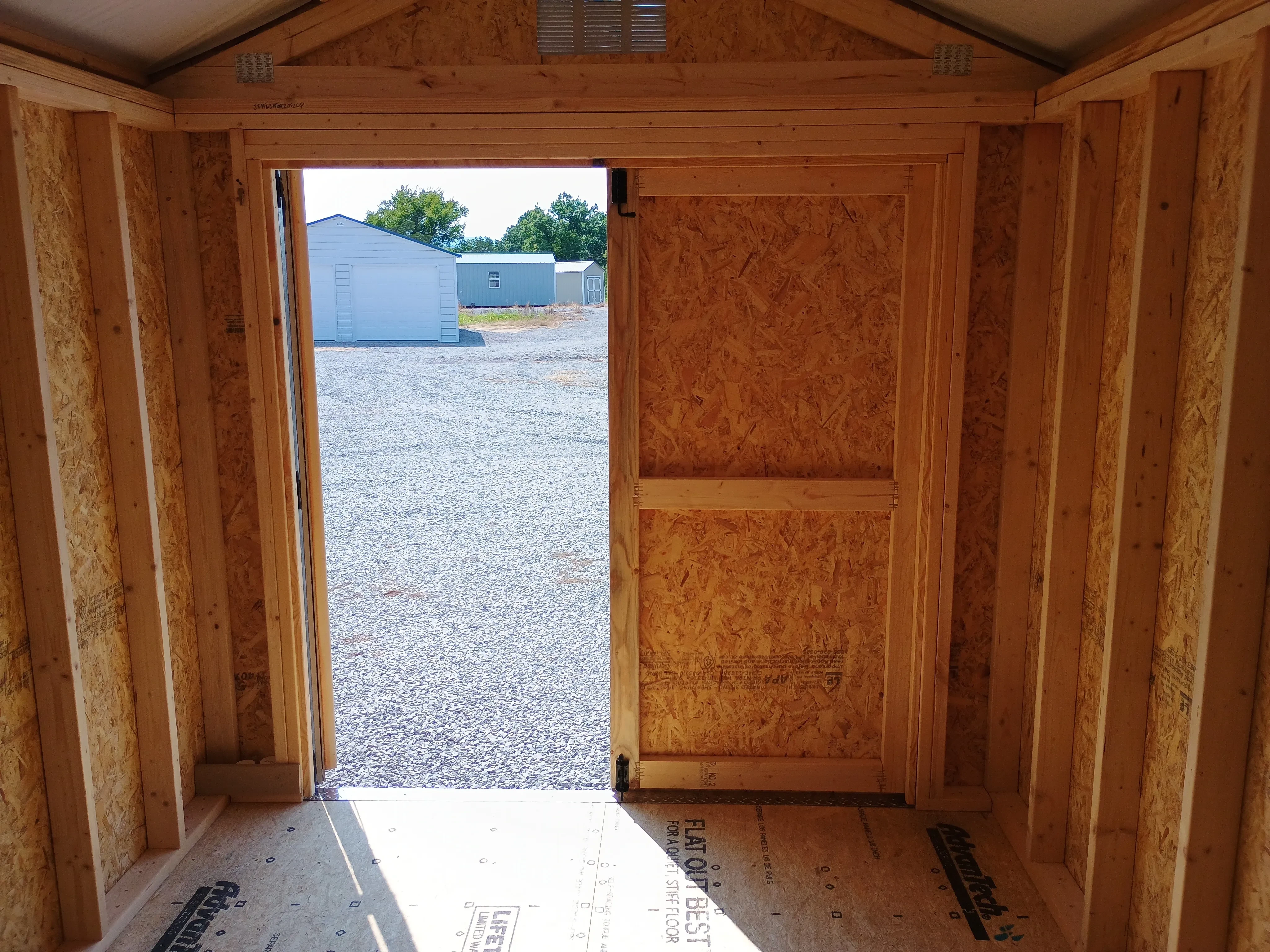Inside of 8x12 utility shed with double doors.