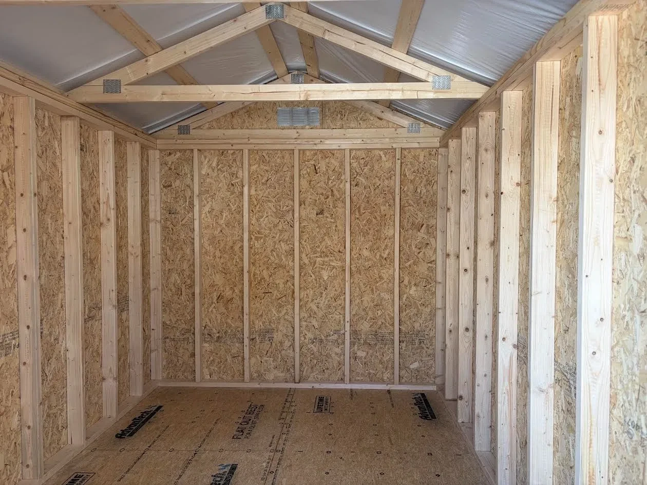 inside of the open shed with white radiant barrier on roof only