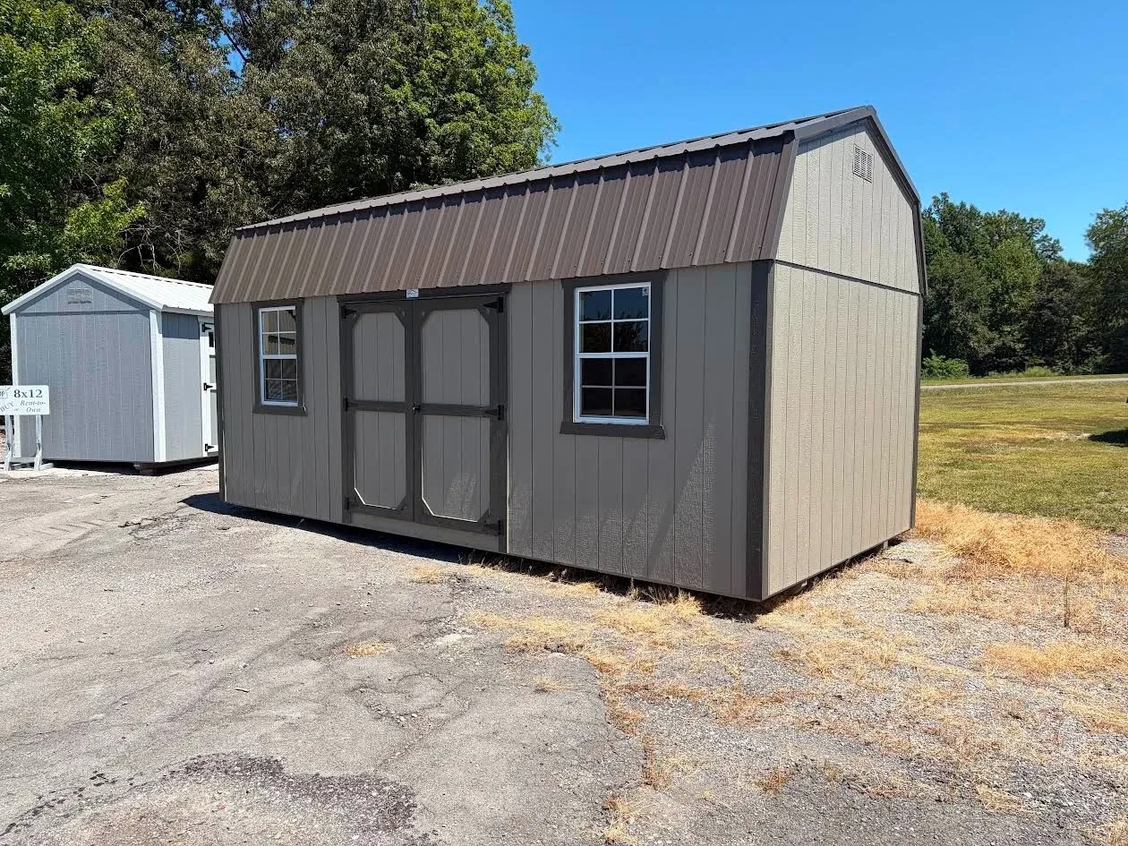 side view of the wood side lofted barnfeatures clay siding, roof and trim bronze