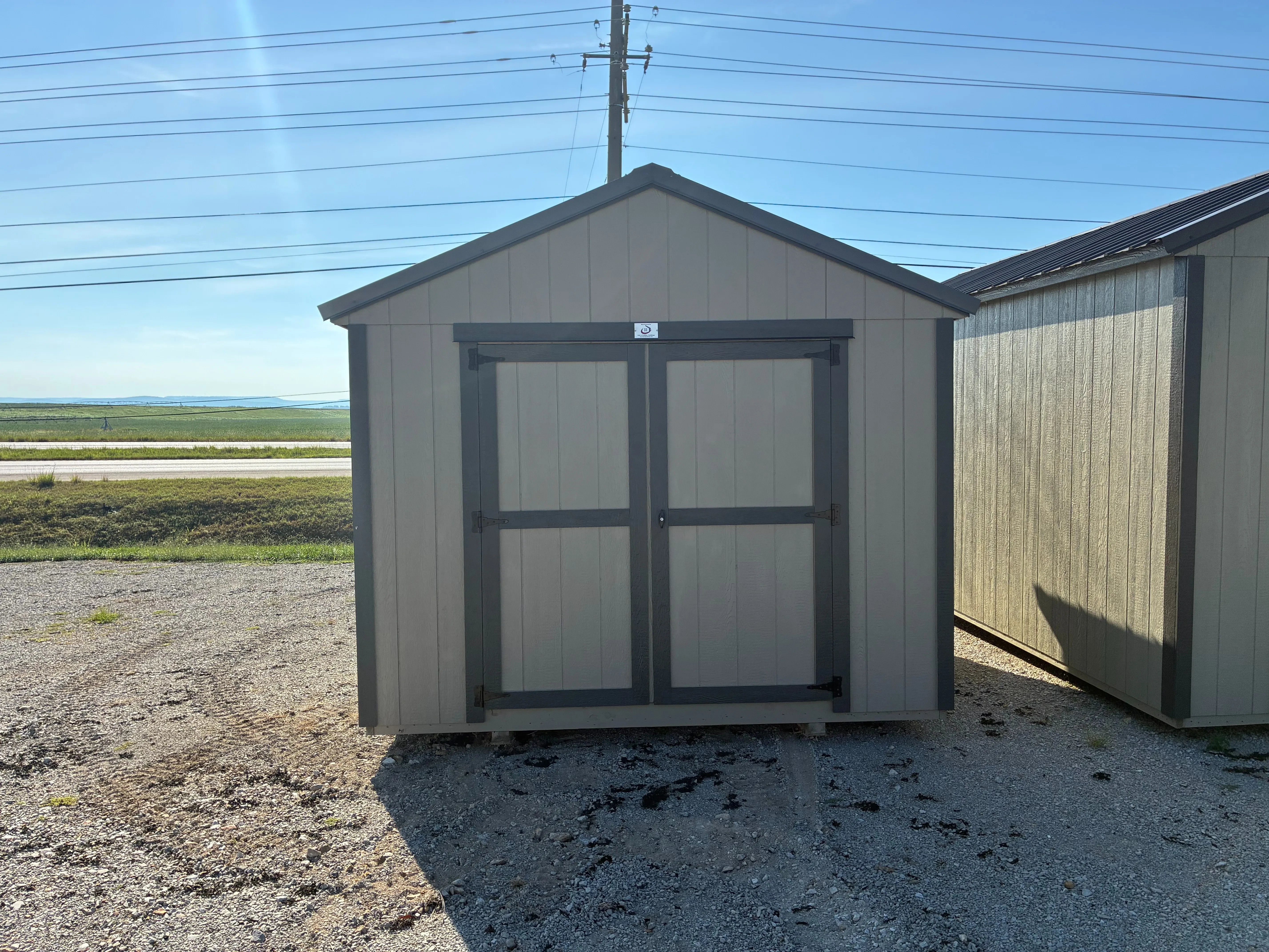 exterior of 10x12 utility shed showing double doors
