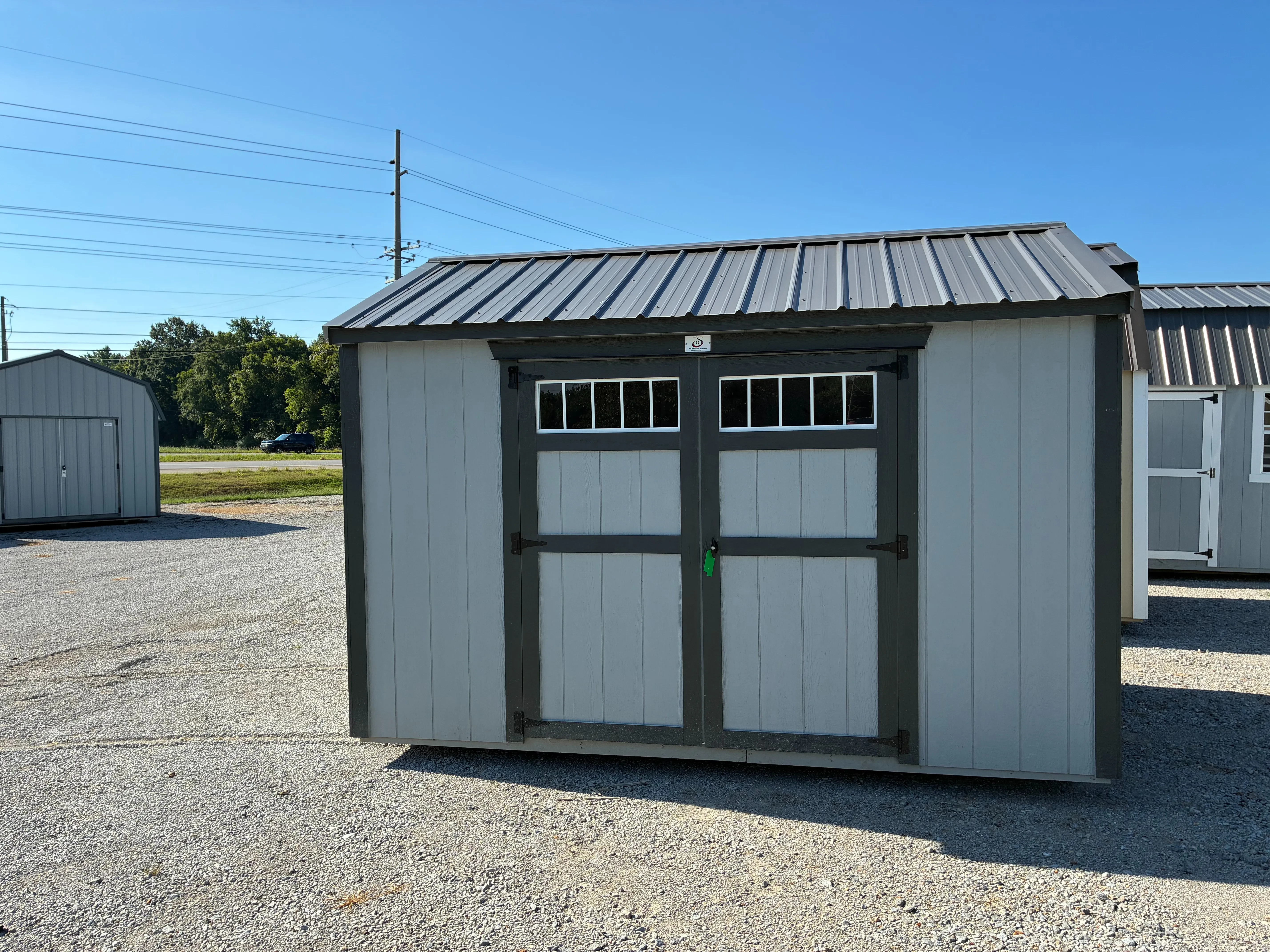 exterior of 8x12 garden shed showing transom windows in double doors