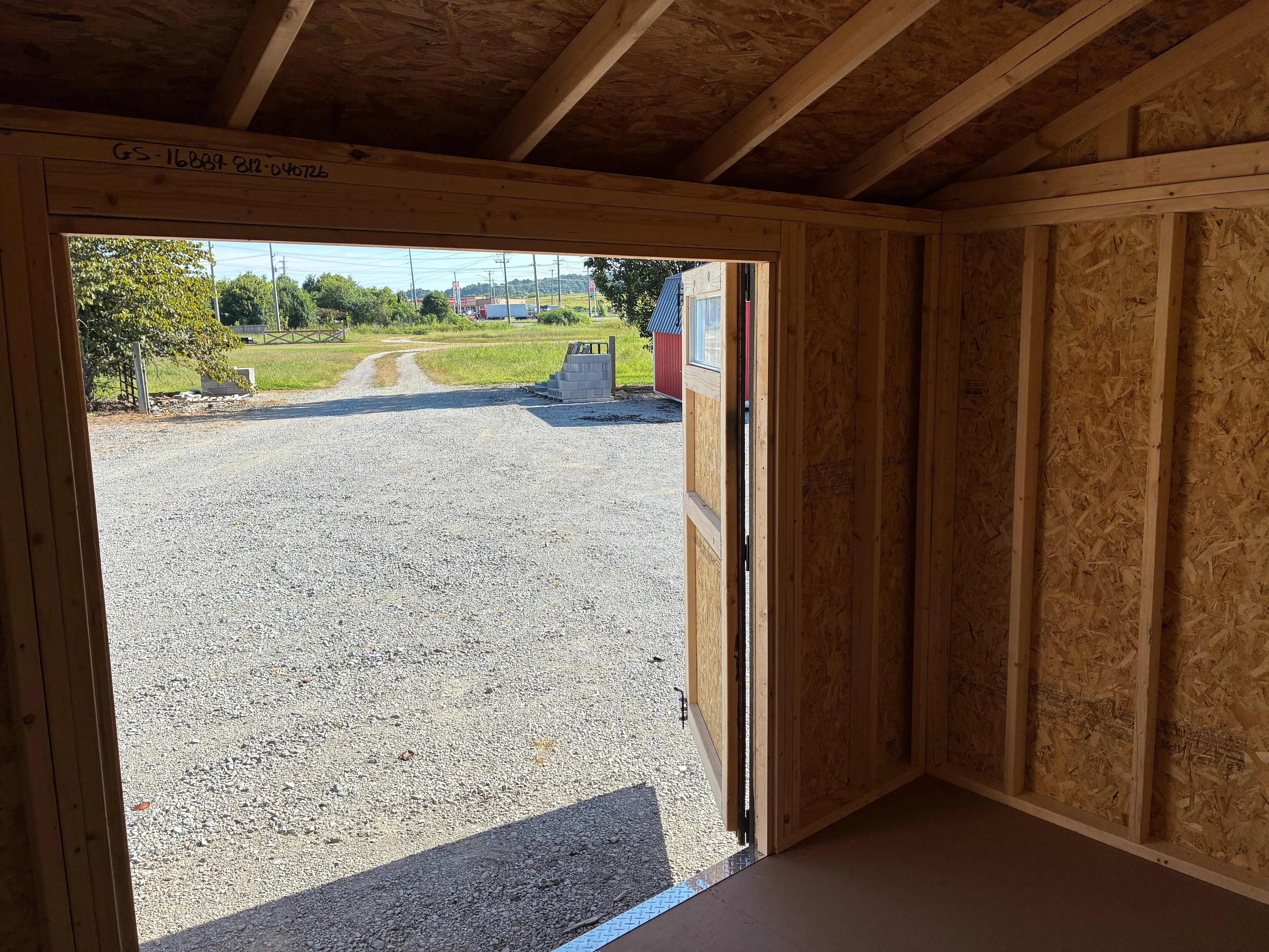 interior of 8x12 garden shed showing double door open