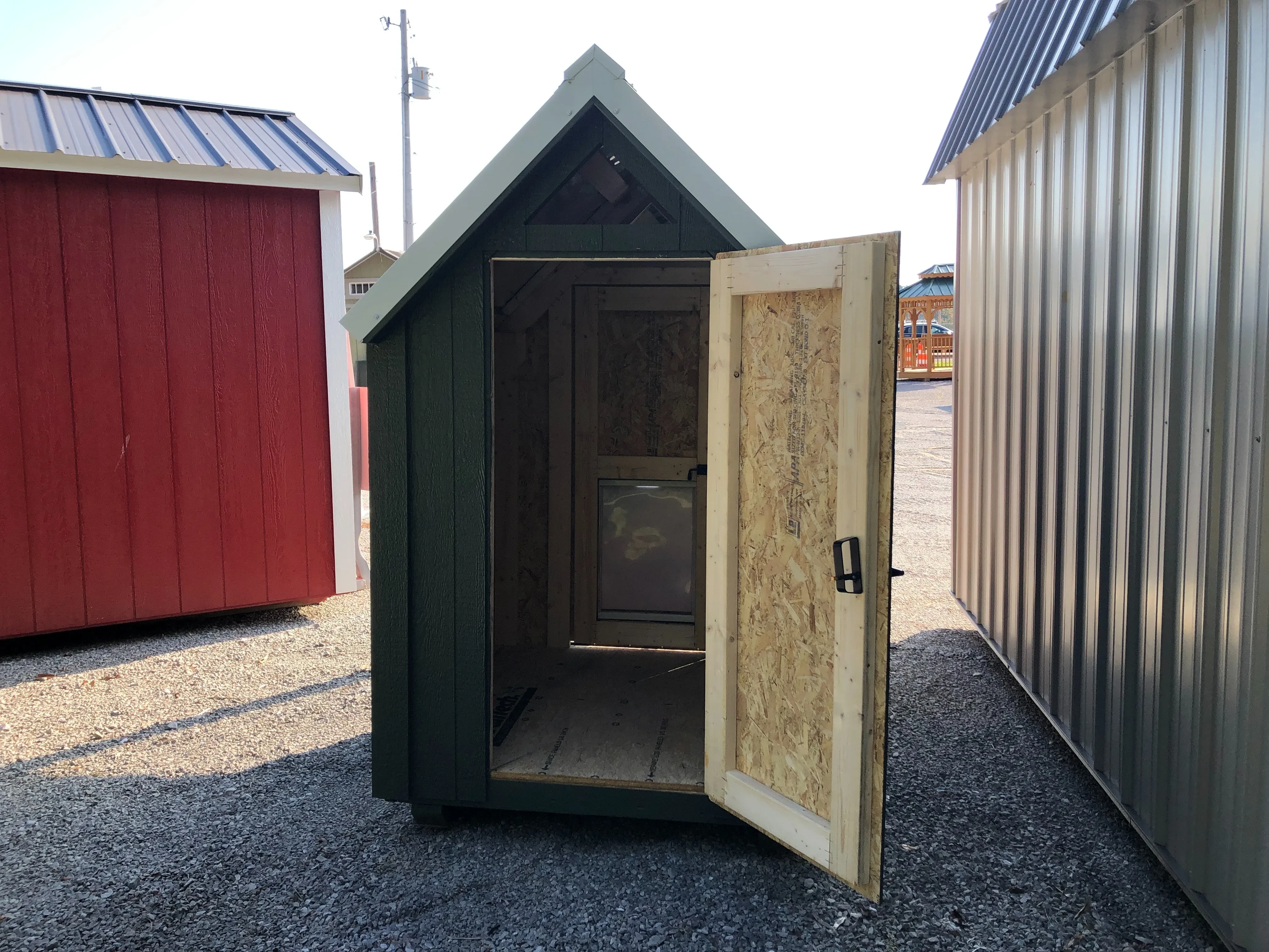 small dog kennel showing the open walk in door