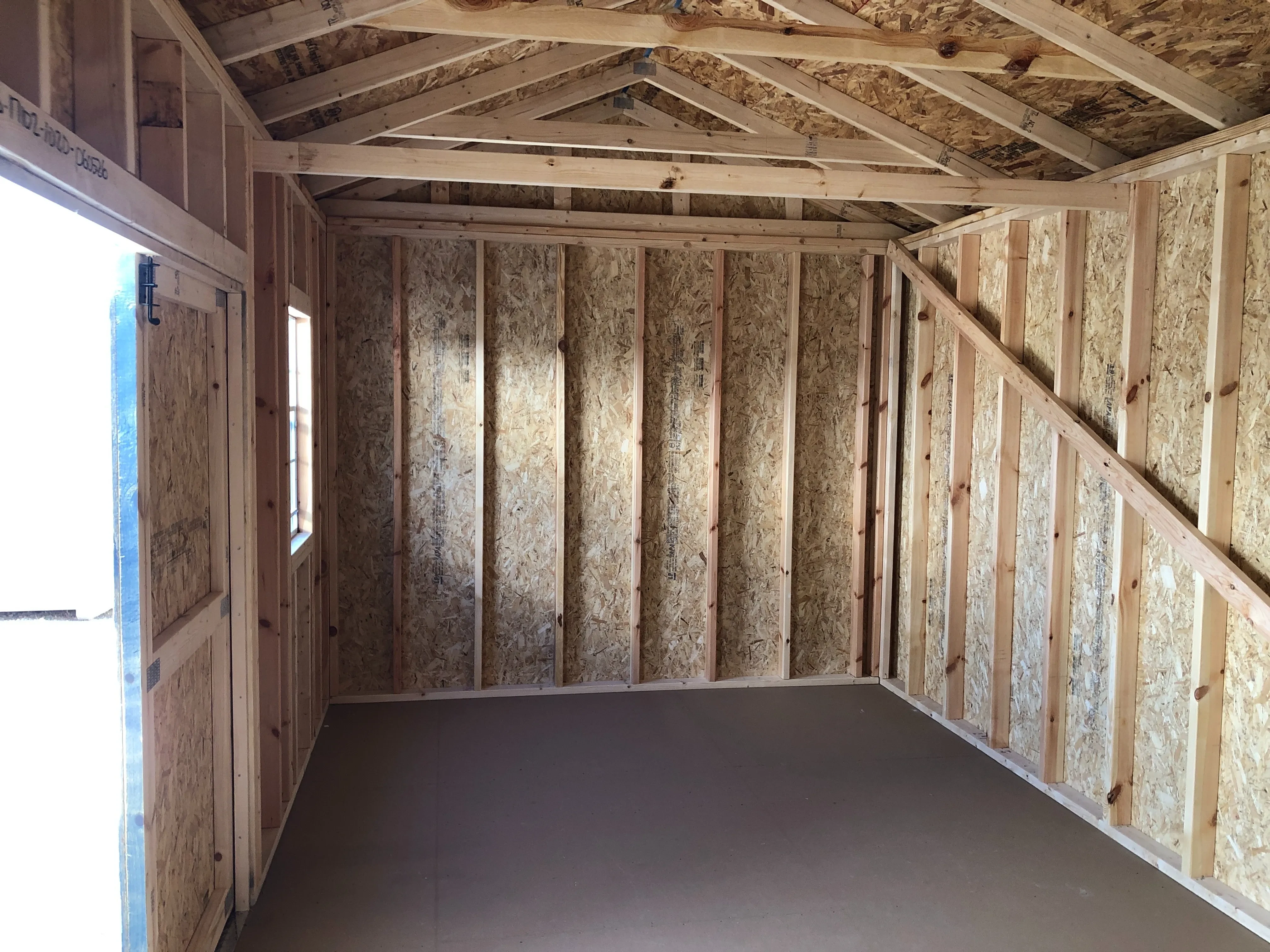 interior of 10x20 garden shed showing floor and window