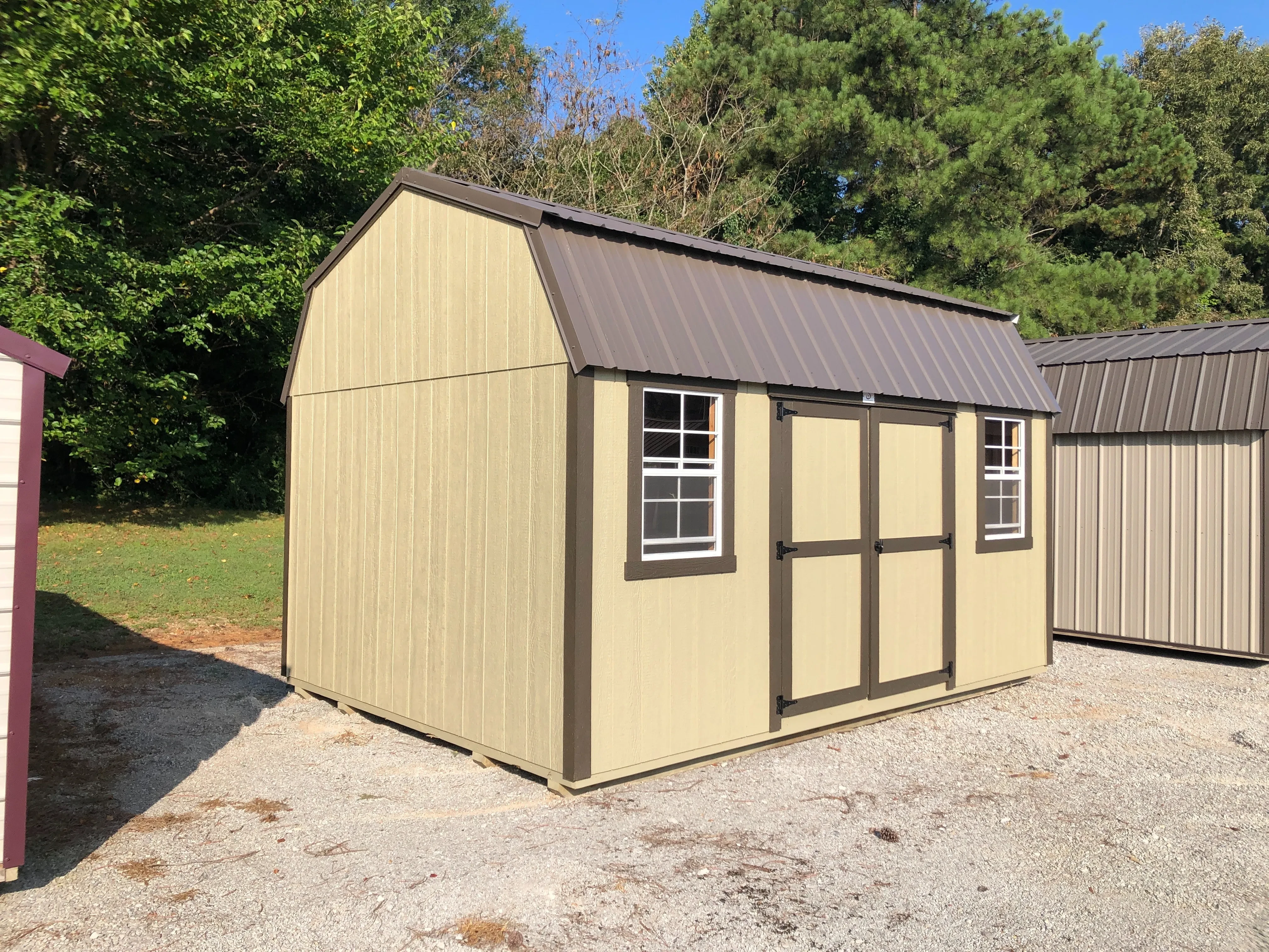 exterior of 12x16 side lofted barn showing double doors and windows