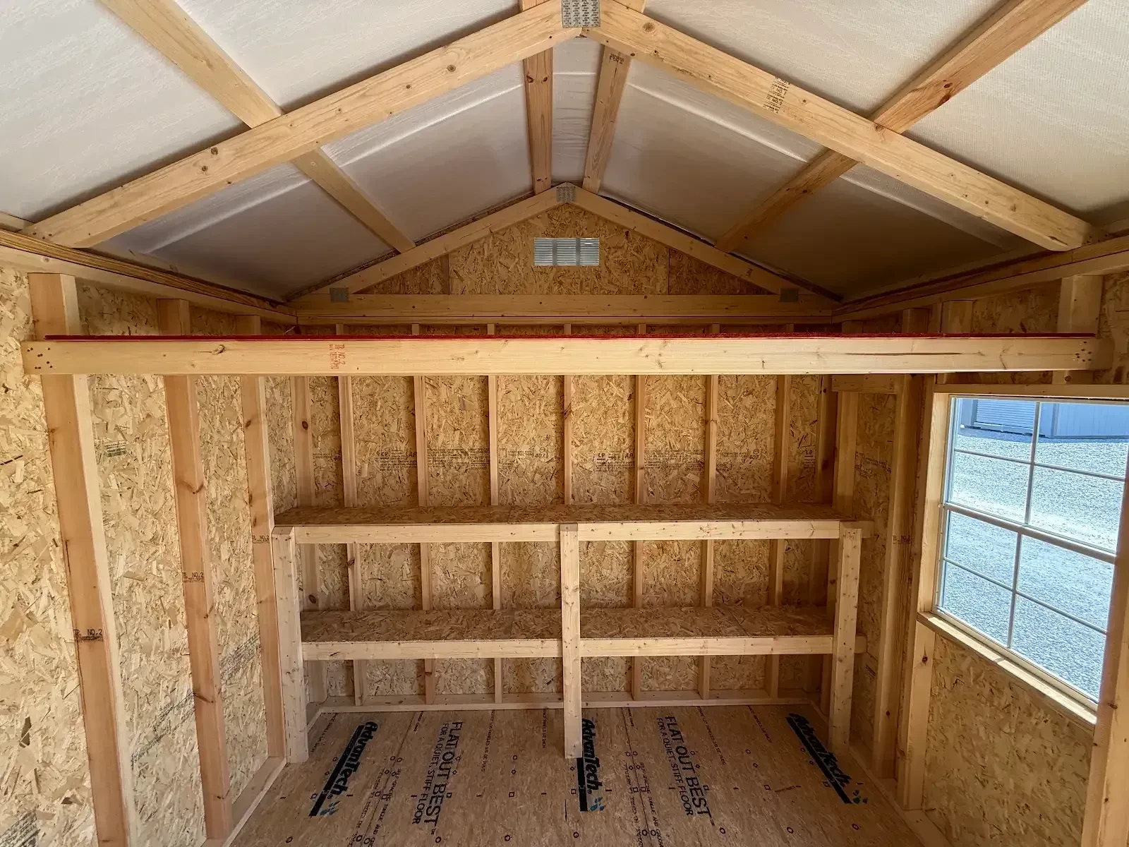 A 4 foot deep loft and 10 feet of double shelves in the end of a 10x20 garden shed