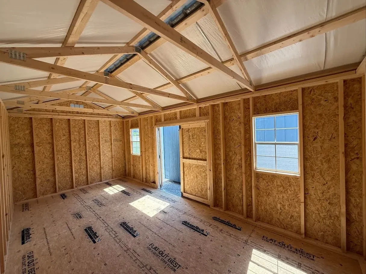 The inside of of a 10x20 Garden Shed with double doors and two windows in the side
