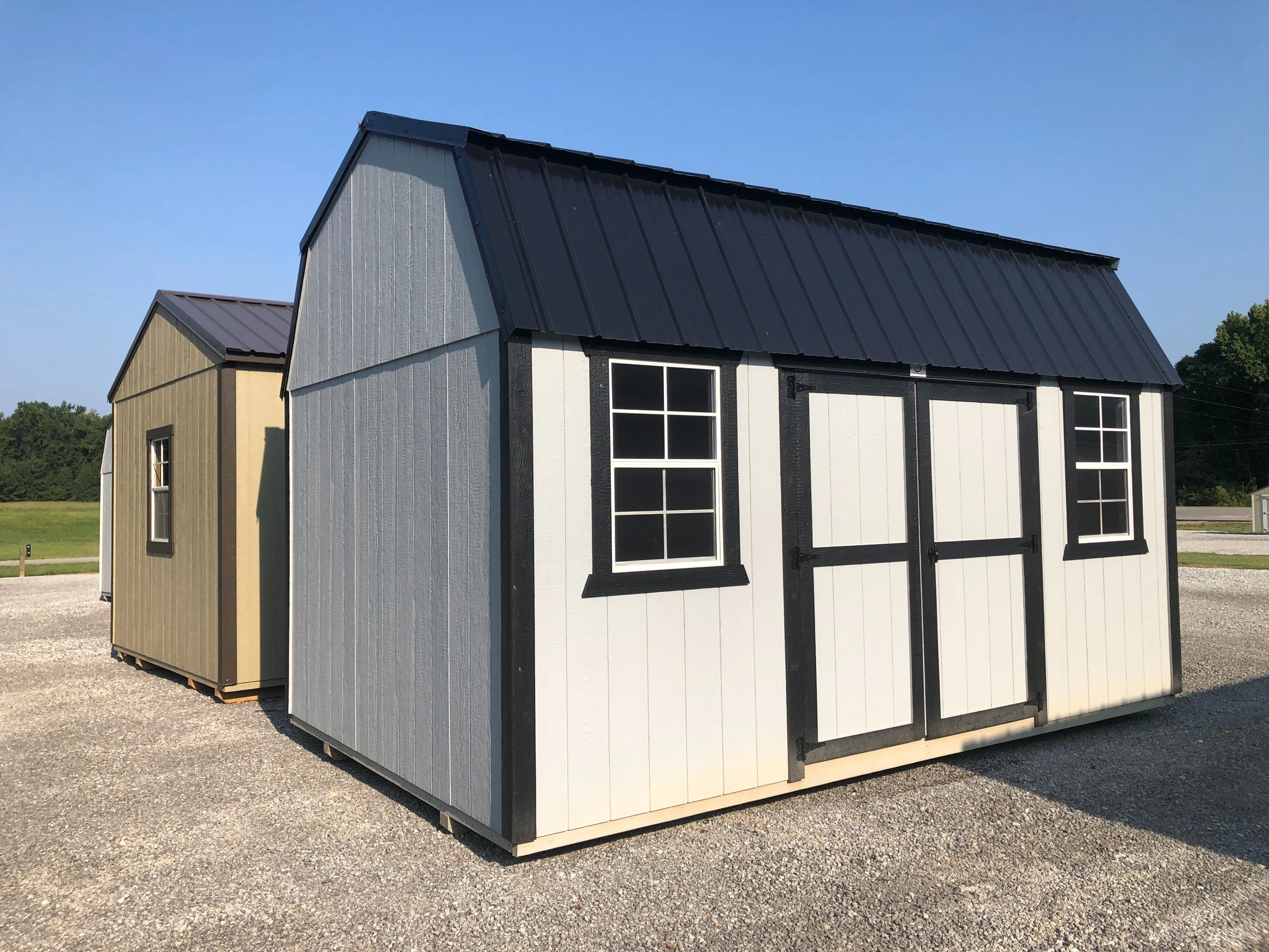 exterior of 10x16 side lofted barn showing doors and windows