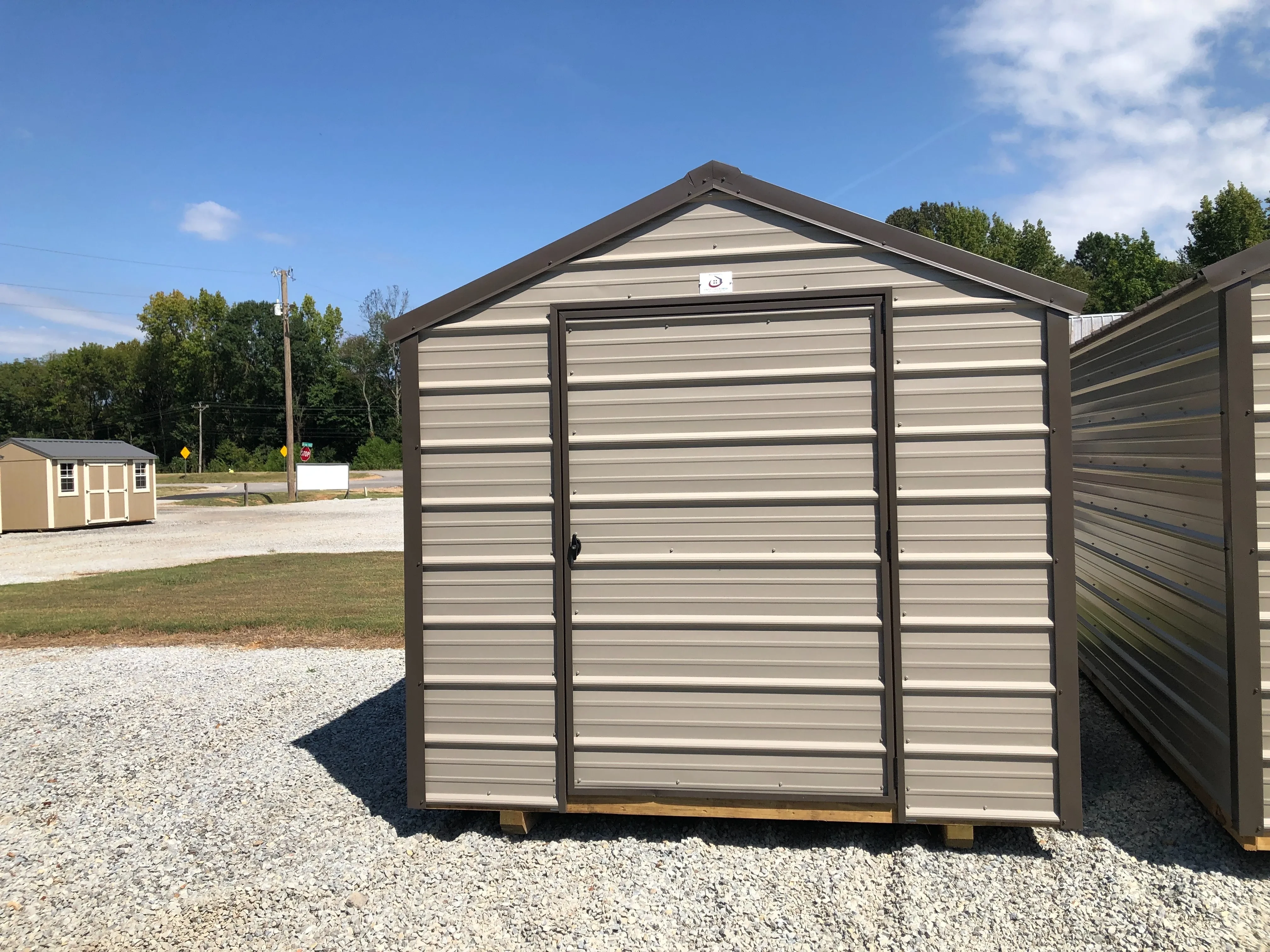 exterior of 8x12 economy metal utility shed showing a single door