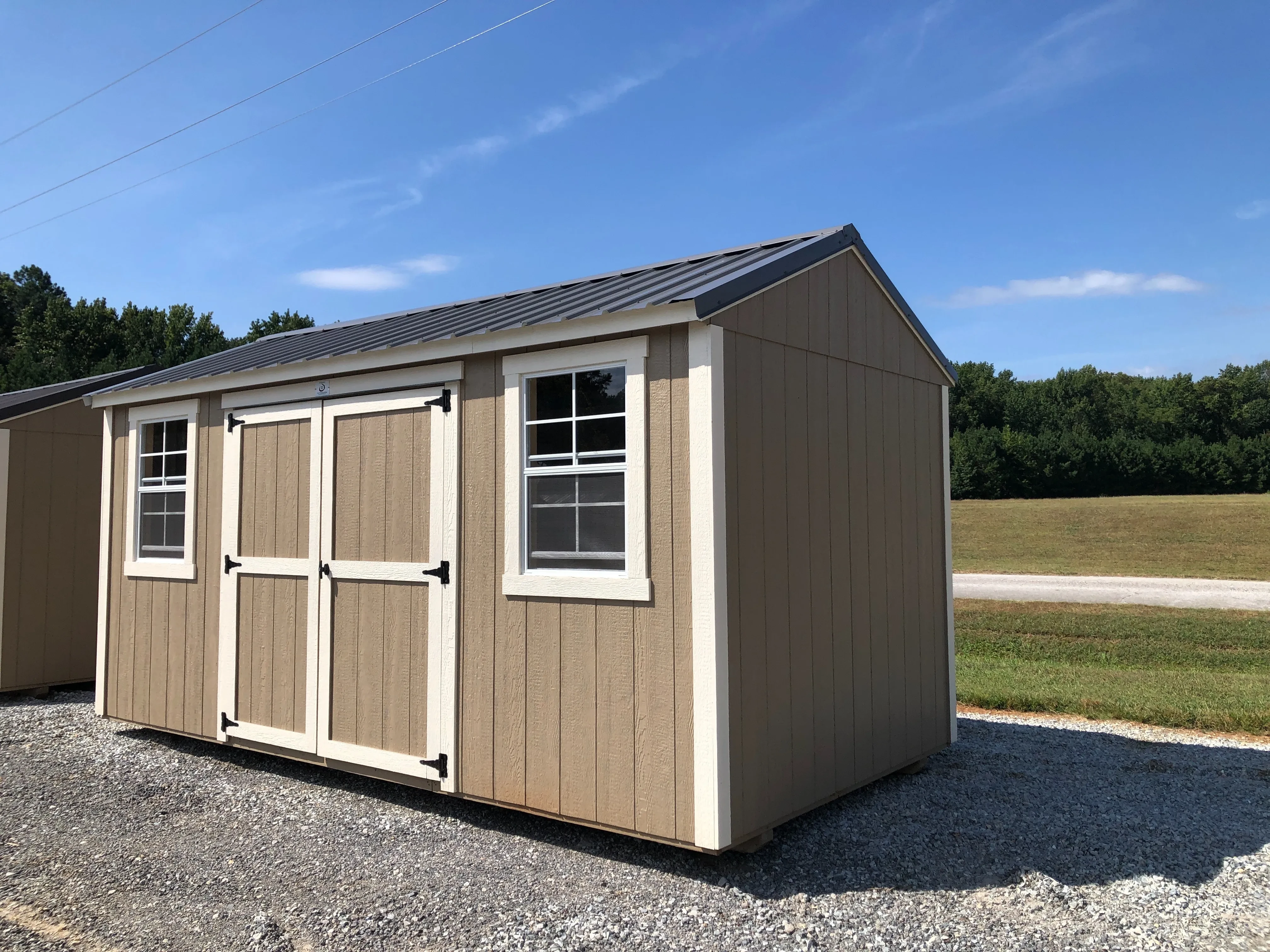 exterior of 8x16 garden shed showing double doors and 2 windows