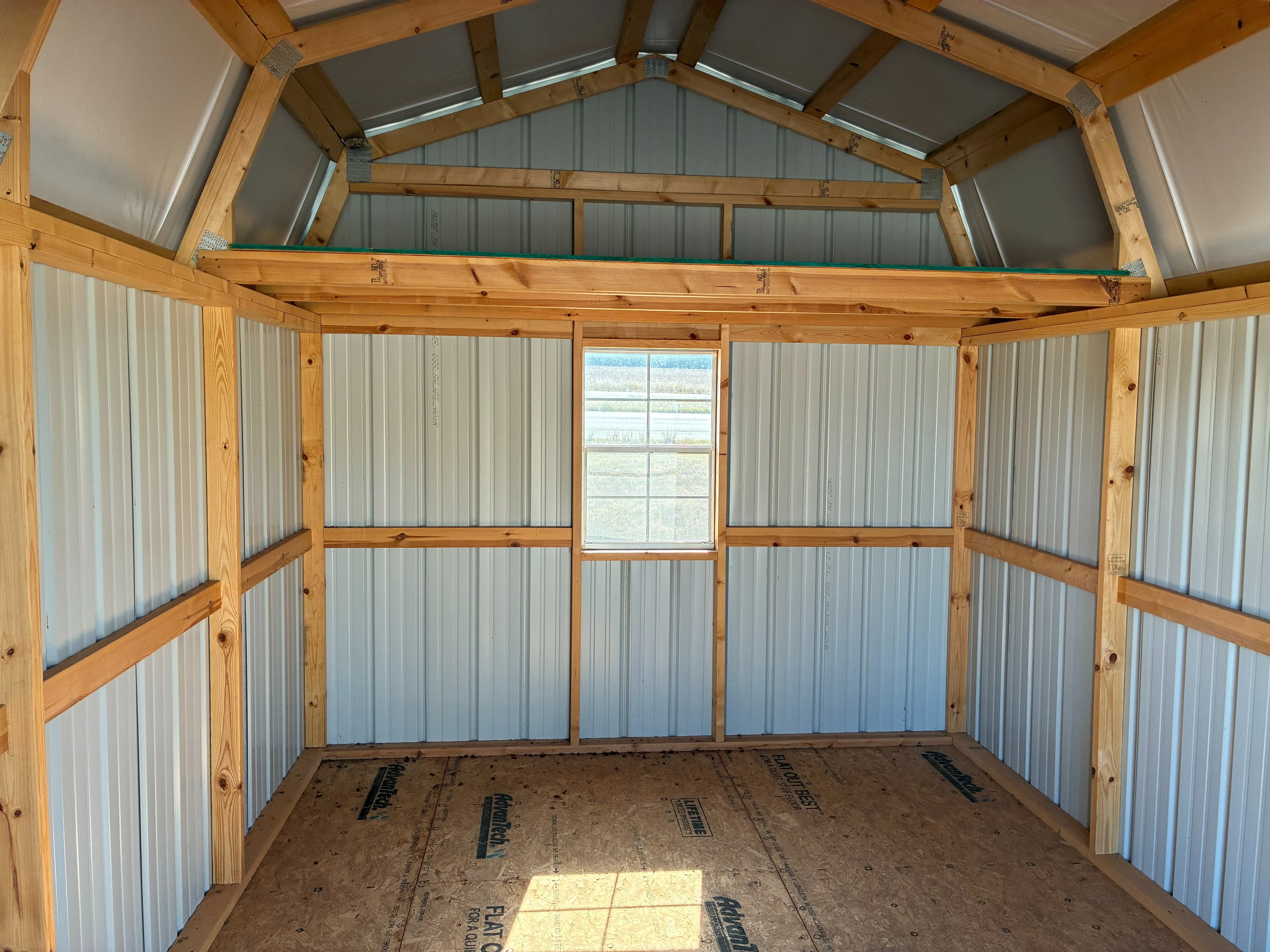 Interior of Lofted Barn showing window and loft.