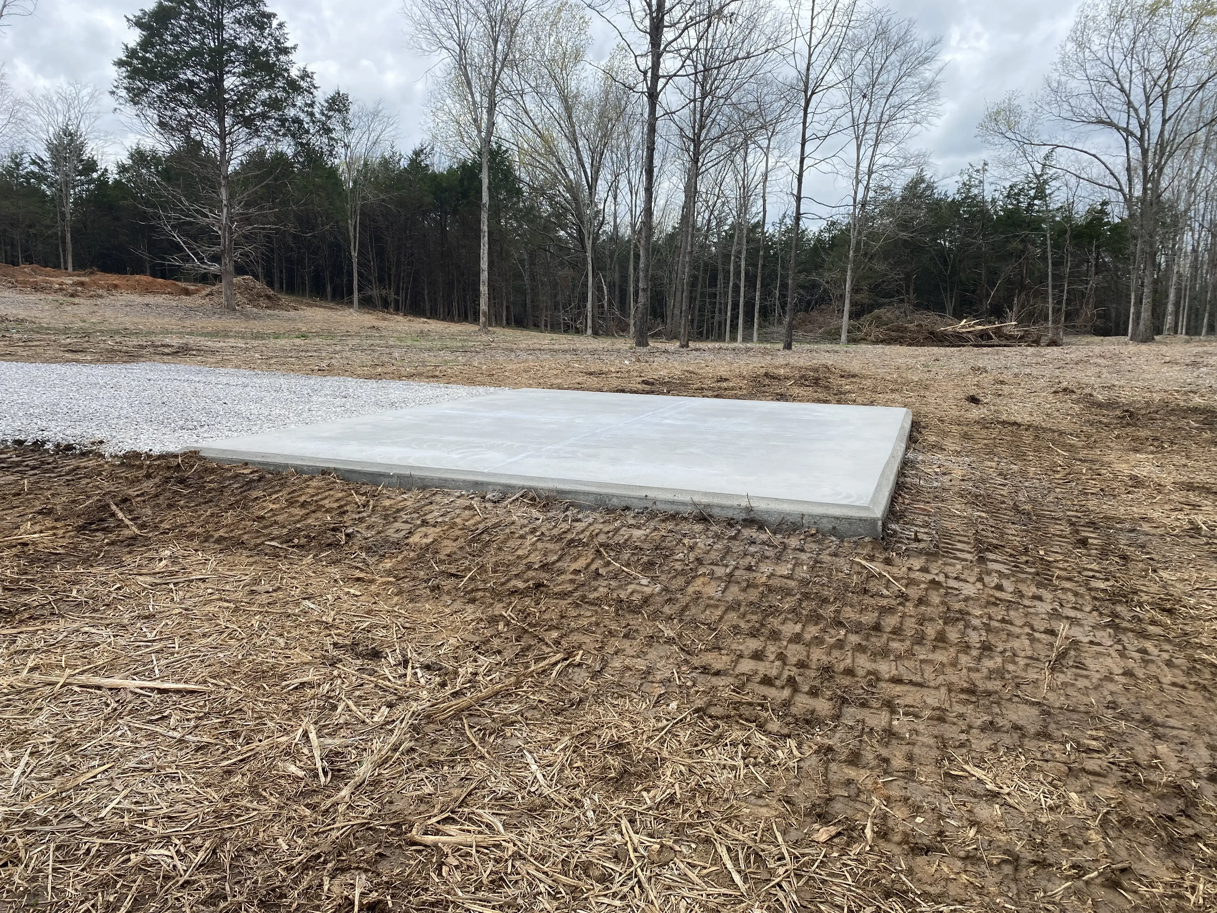 Closeup of finished concrete slab and driveway