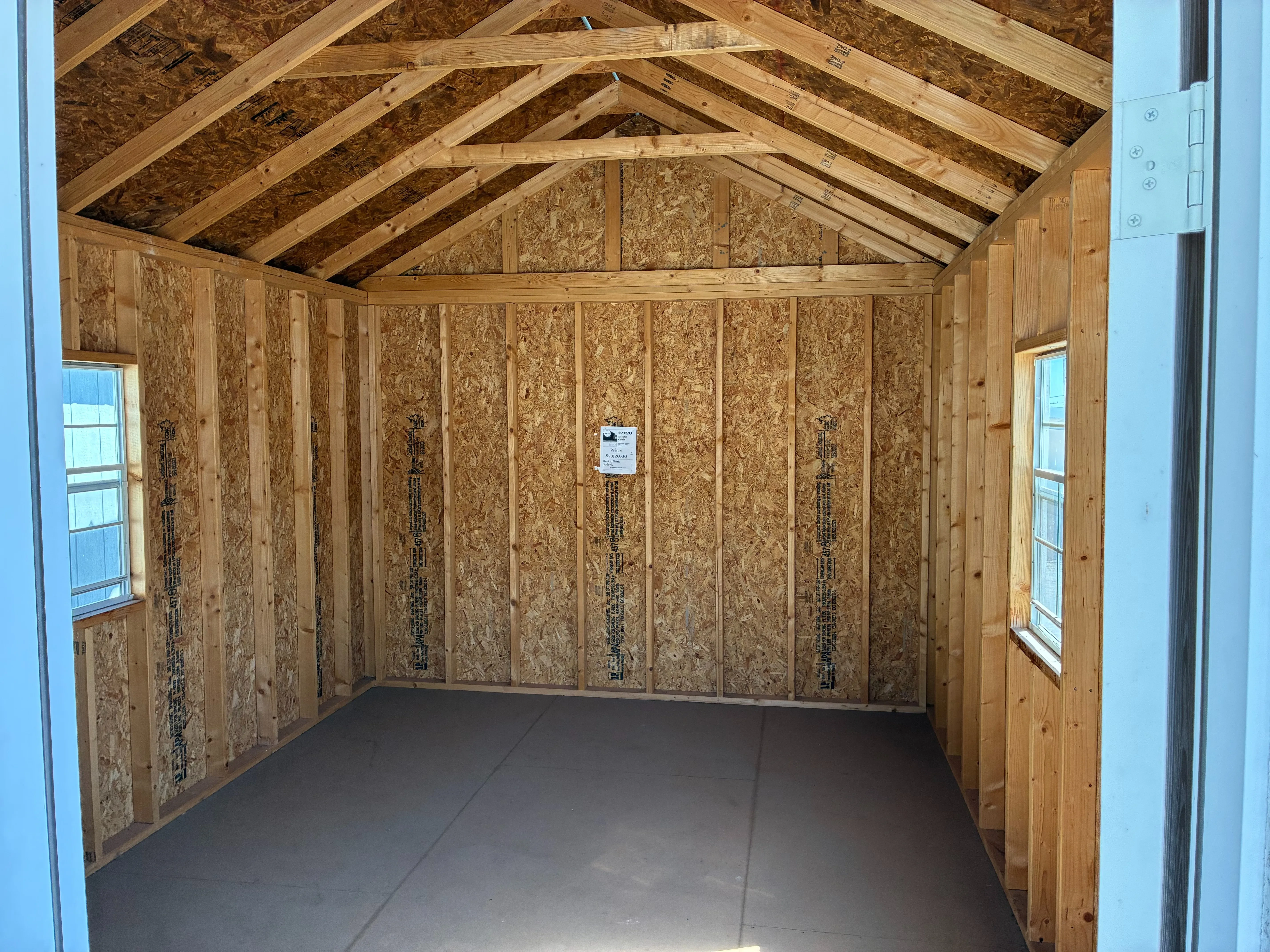 Interior of 10x12 Wood Cabin Showing 2 windows