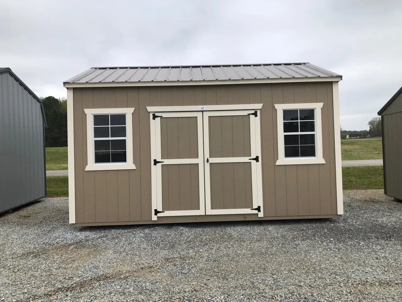 exterior of 10x16 garden shed showing double doors and (2) windows