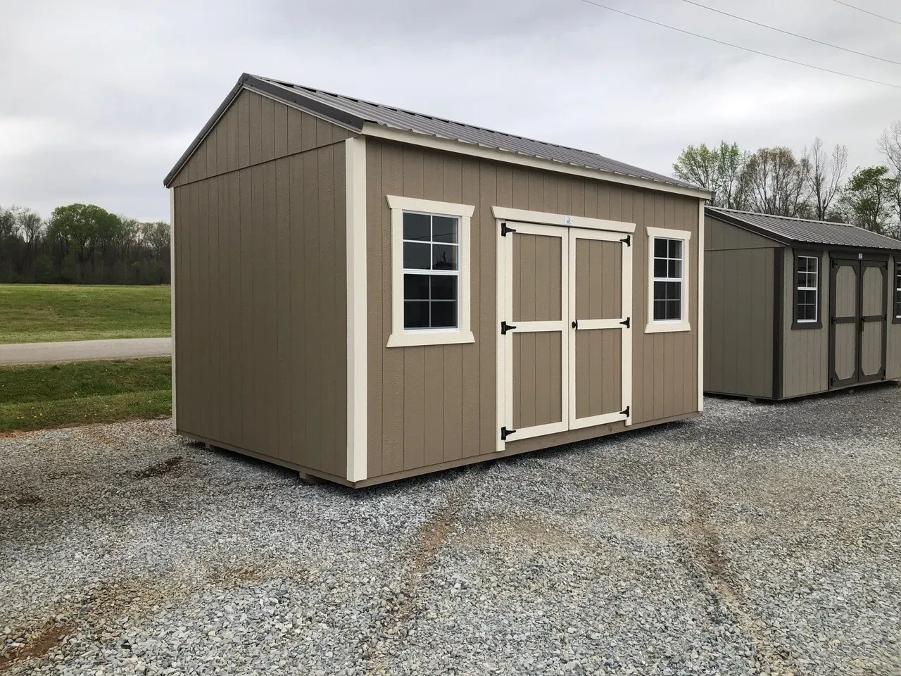 exterior of 10x16 garden shed showing double doors and (2) windows