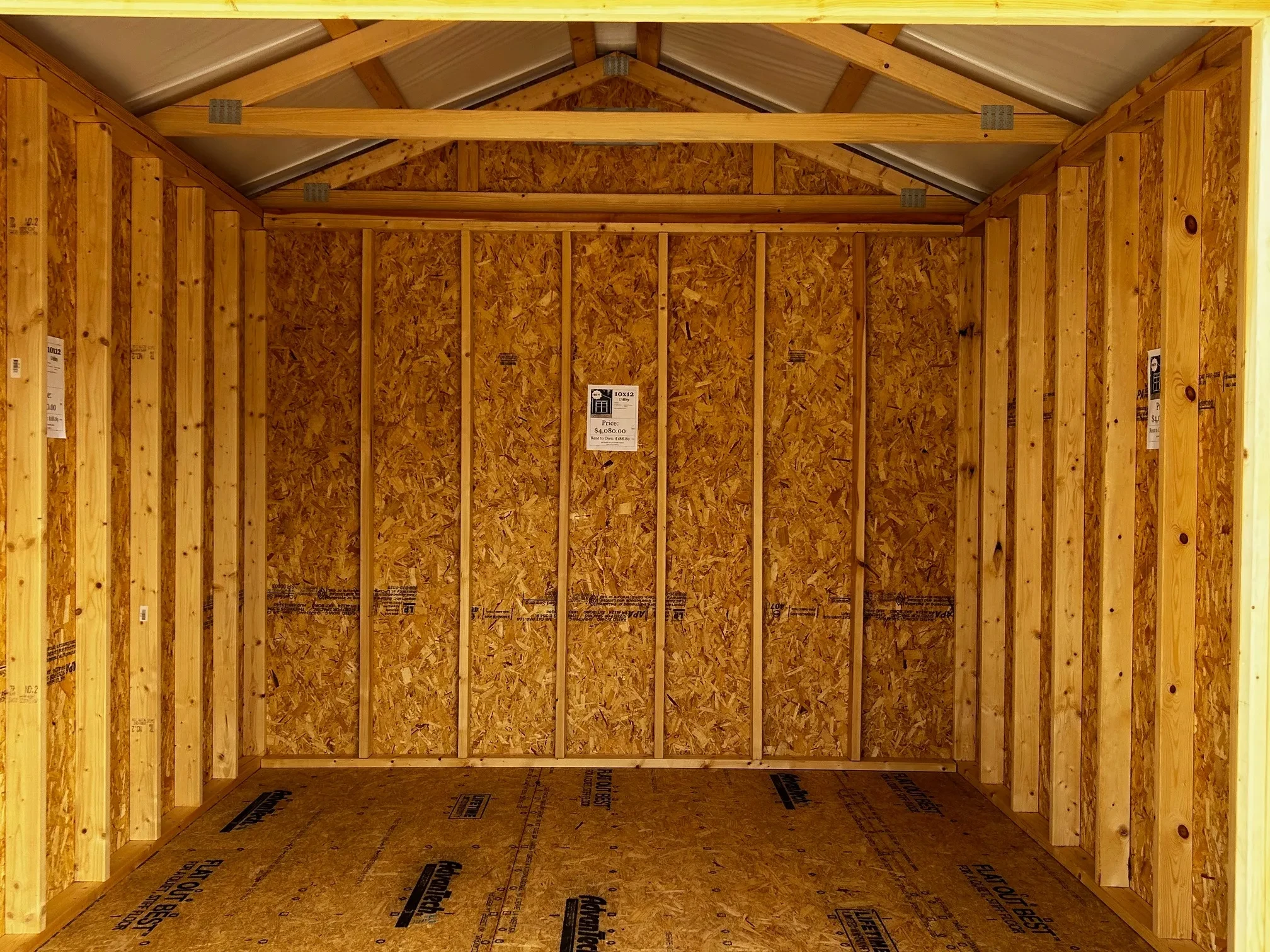 The inside of a wood shed showing the back wall