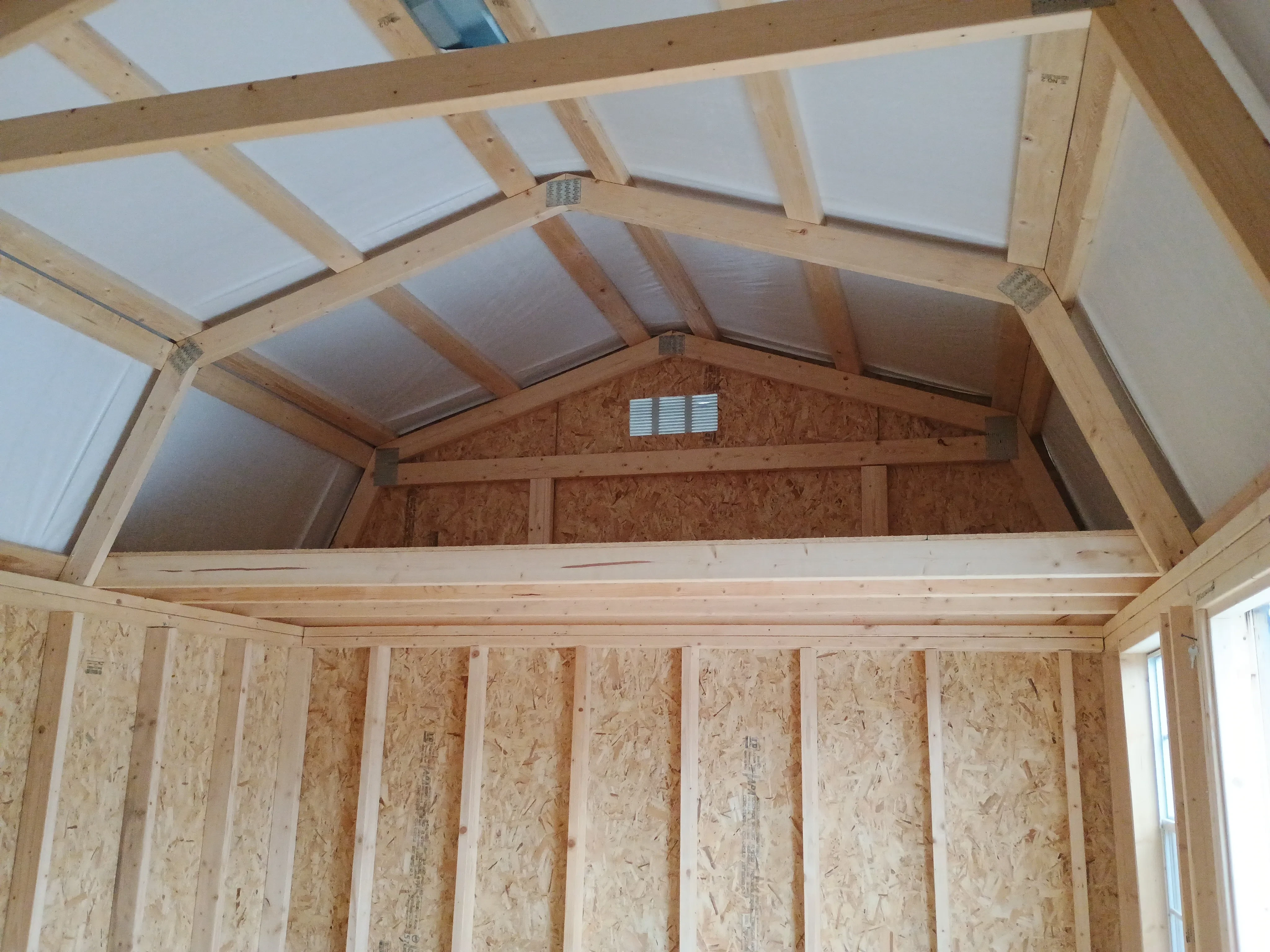 Inside of 10x16 painted side lofted barn shed, featuring one of two lofts.