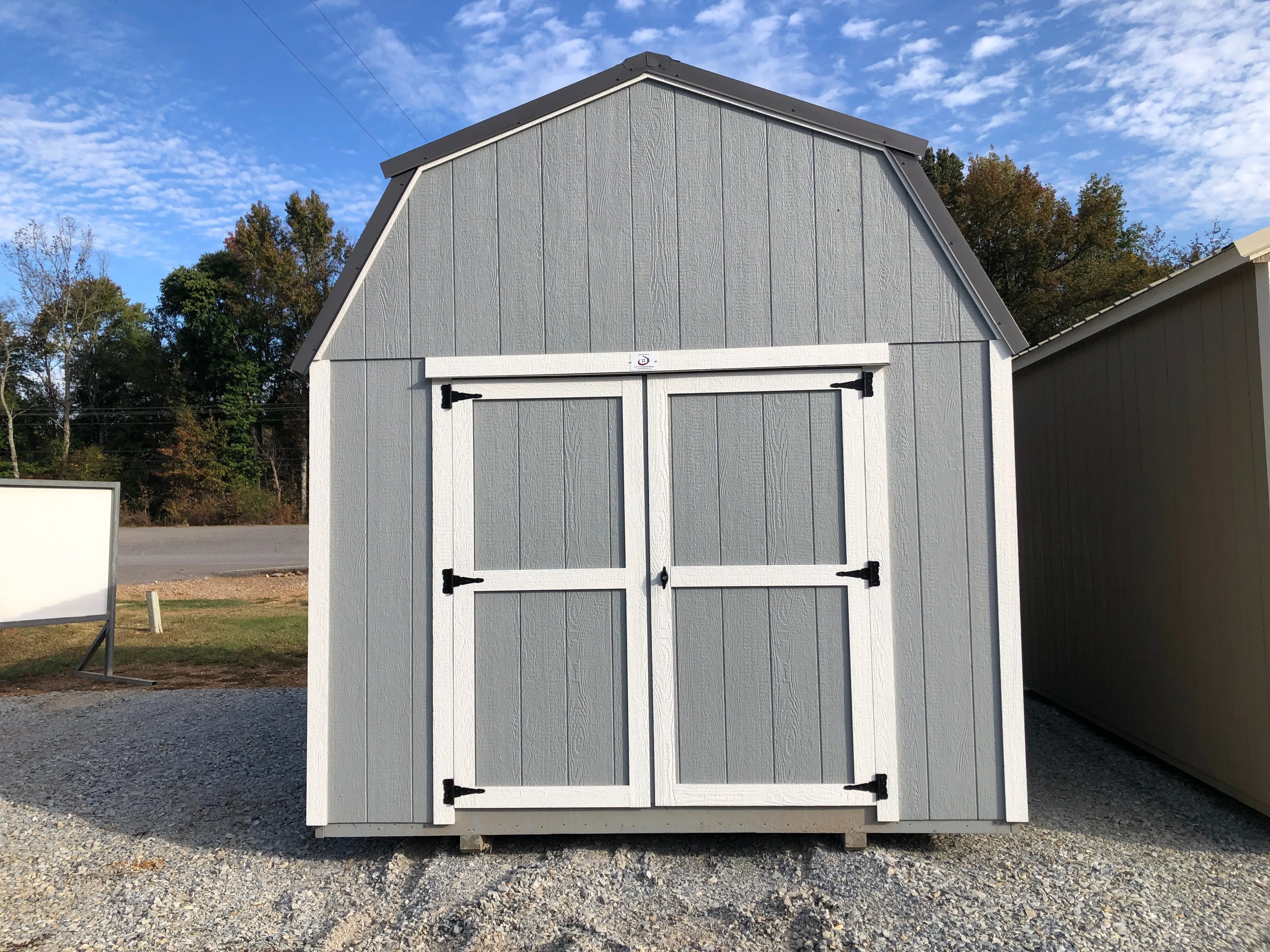 showing exterior of 10x16 lofted barn with double doors