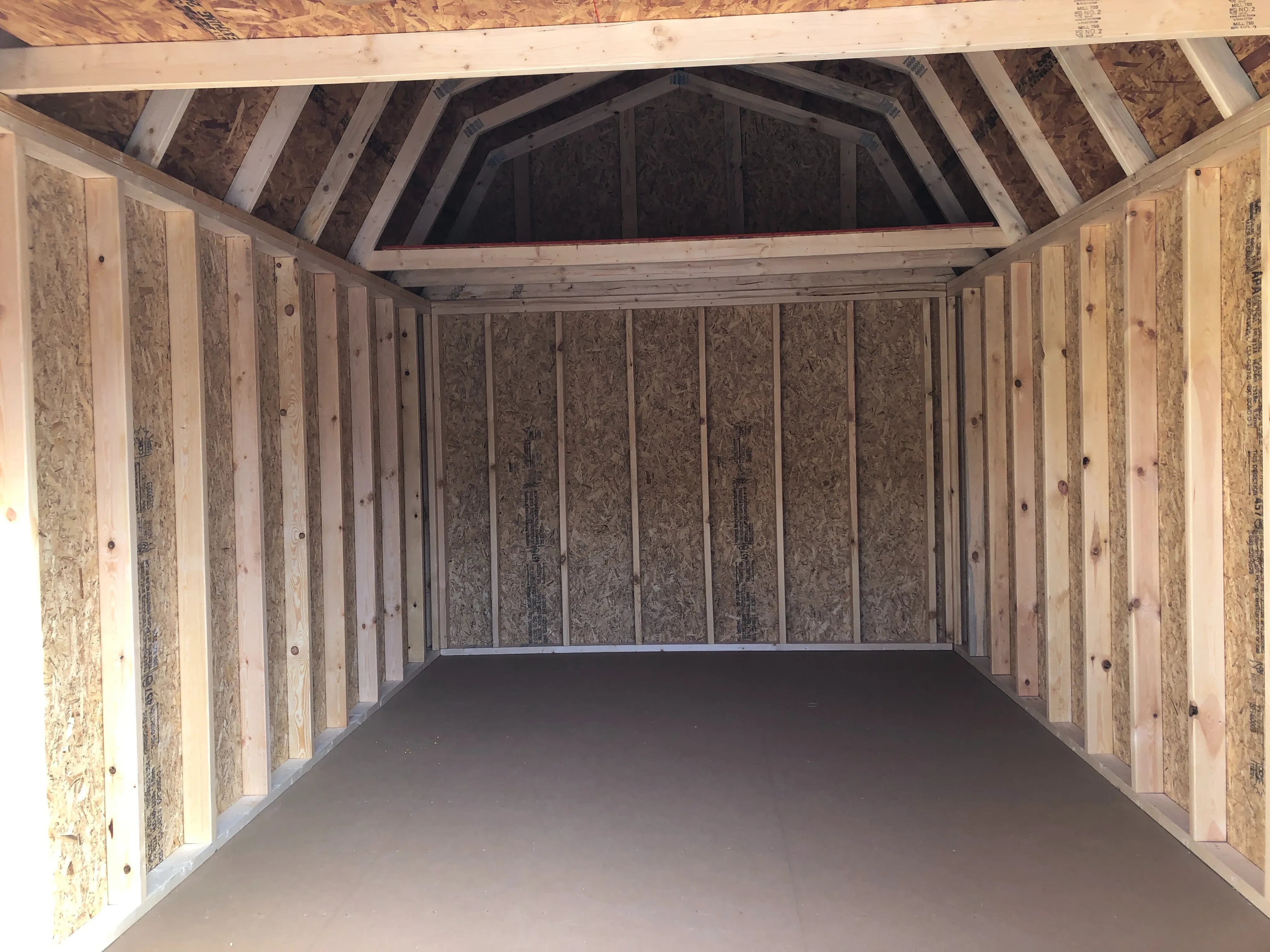 showing interior of 10x16 lofted barn with loft and floor