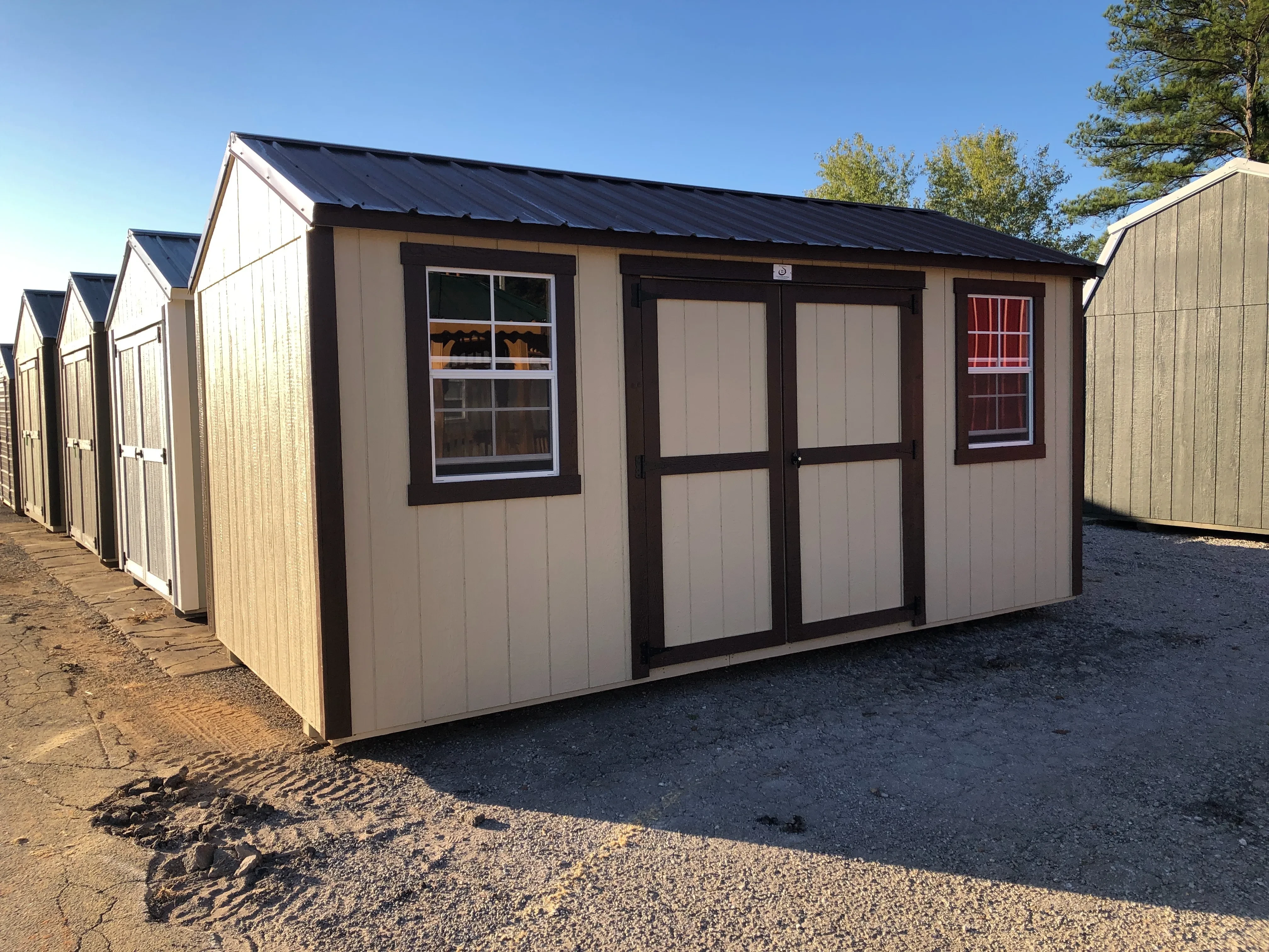 exterior of 8x16 garden shed showing double doors and 2 windows