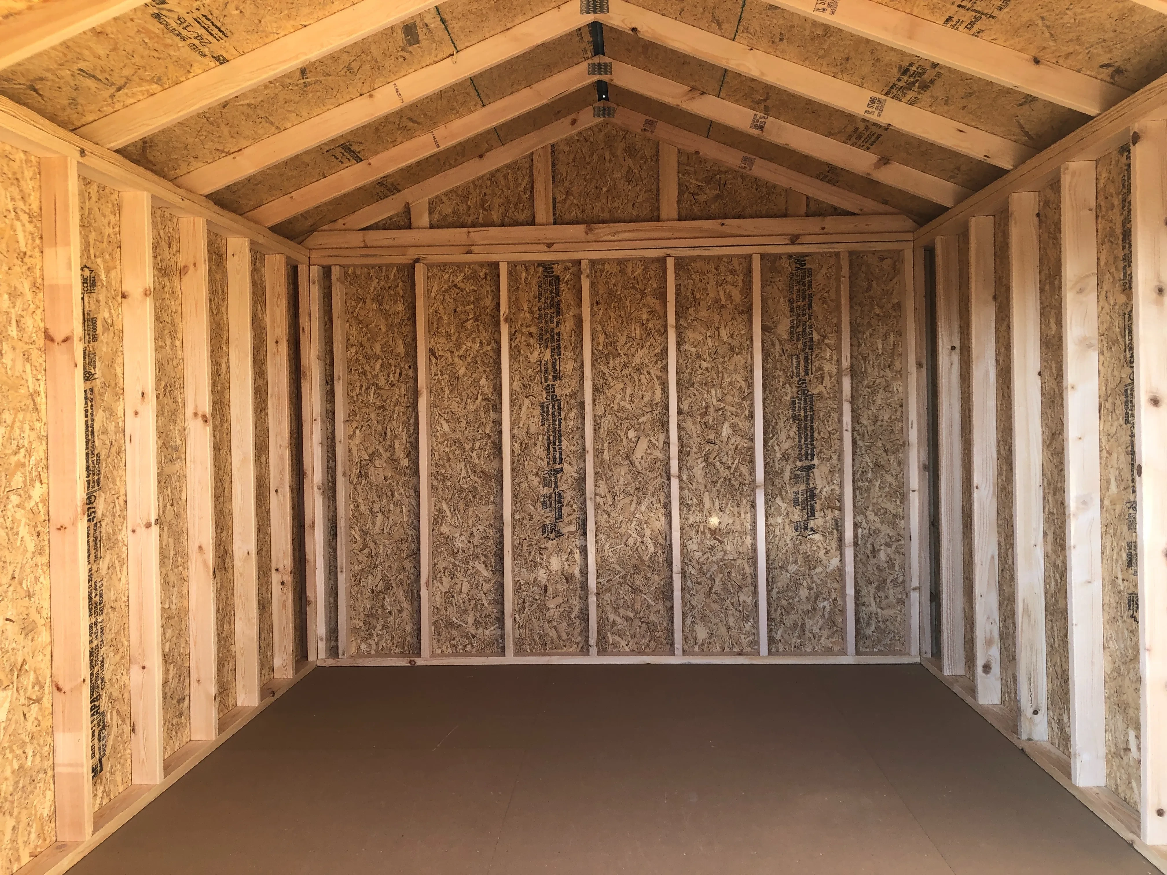 interior of 10x12 utility shed showing the floor and walls