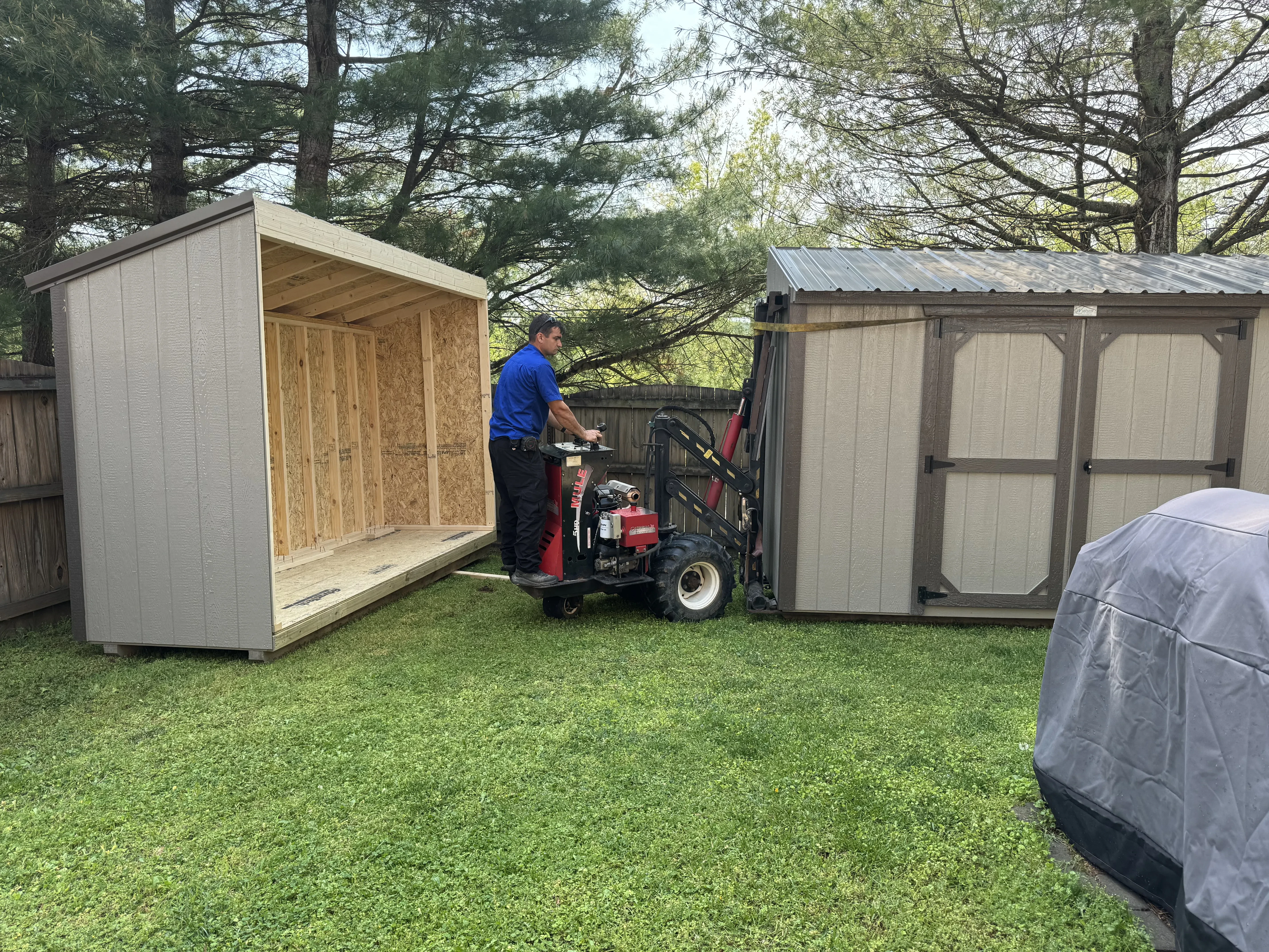 Second half of a shed coming in to a yard.