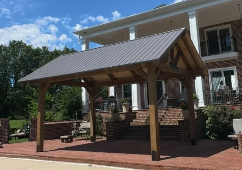 Pavilion by a big house.
