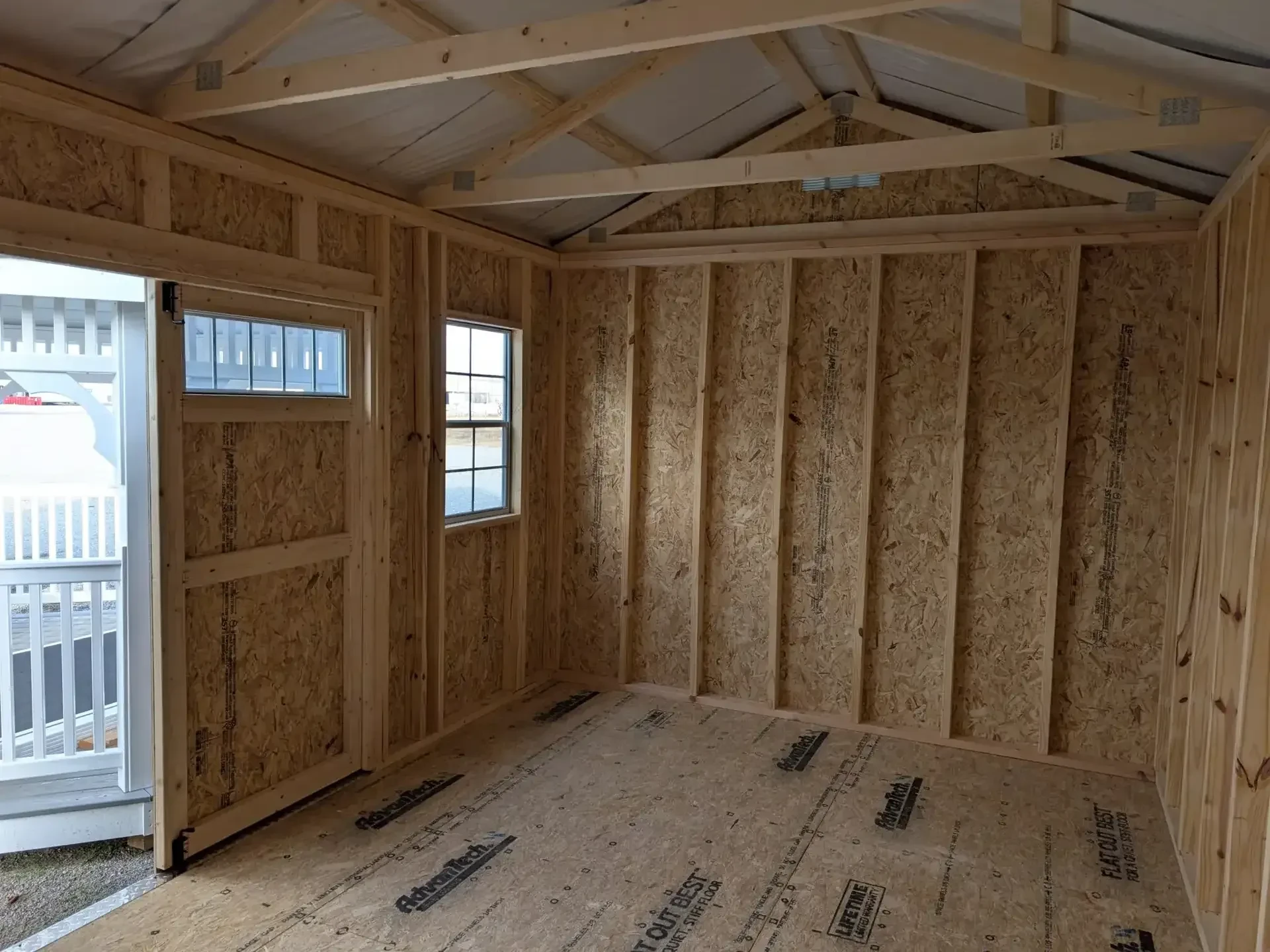 inside a wood garden shed with transom windows and 2x3 windows