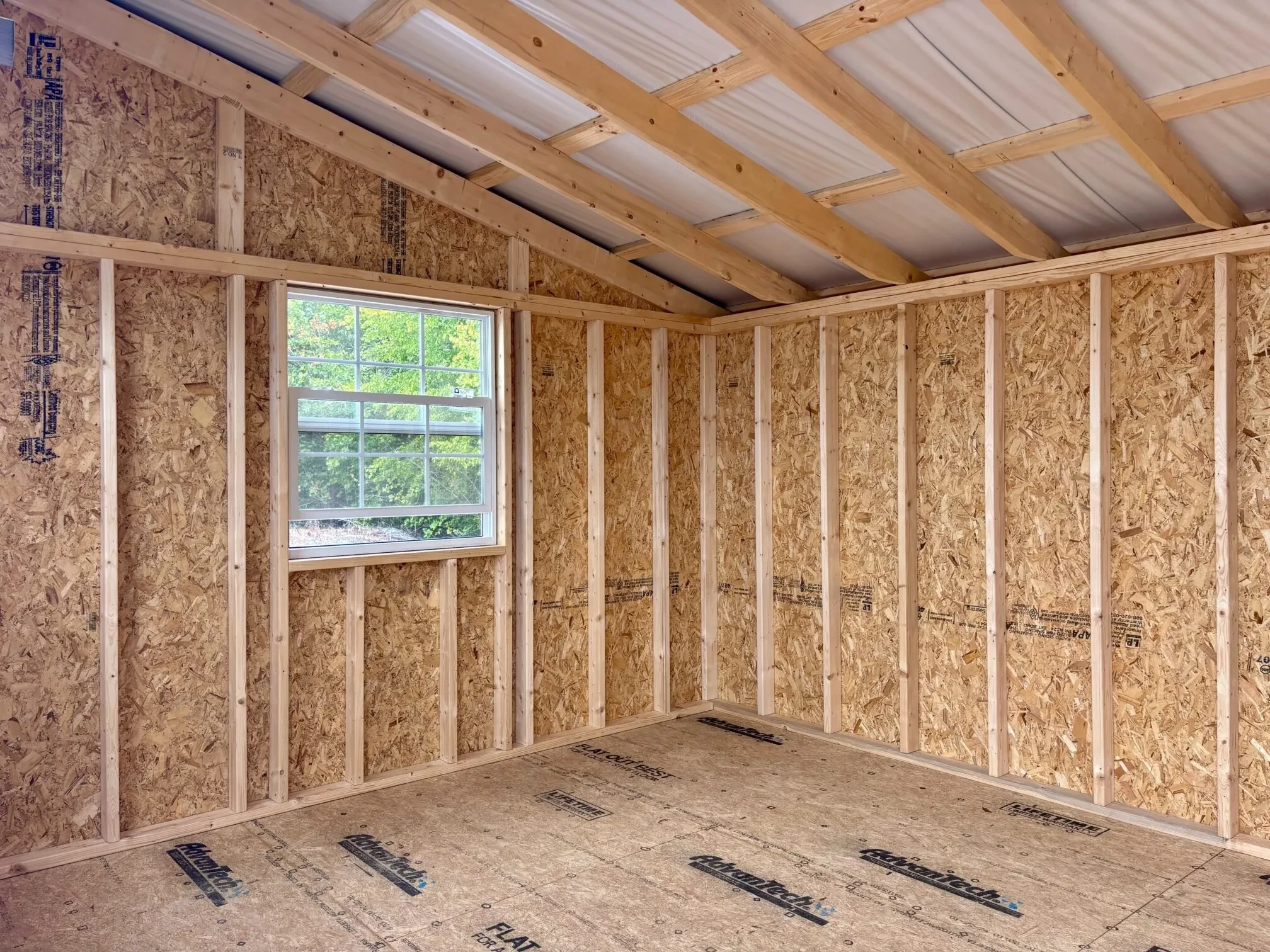 inside a wood shed with a vinyl insulated glass window