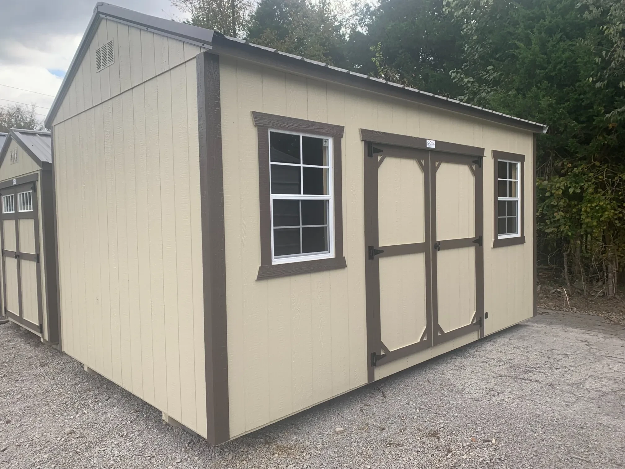 garden shed with double doors and two windows