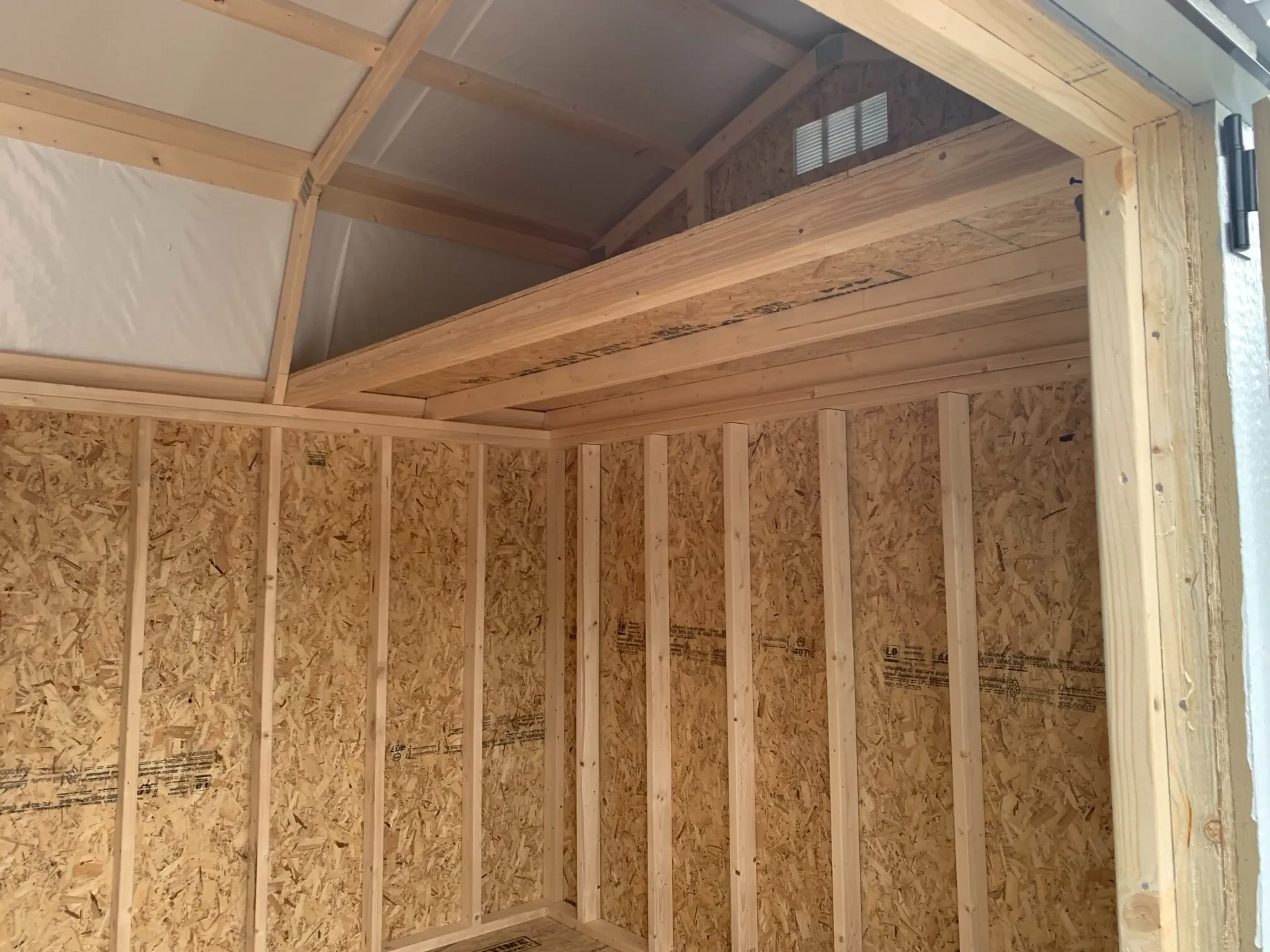 inside a wood lofted barn showing a loft