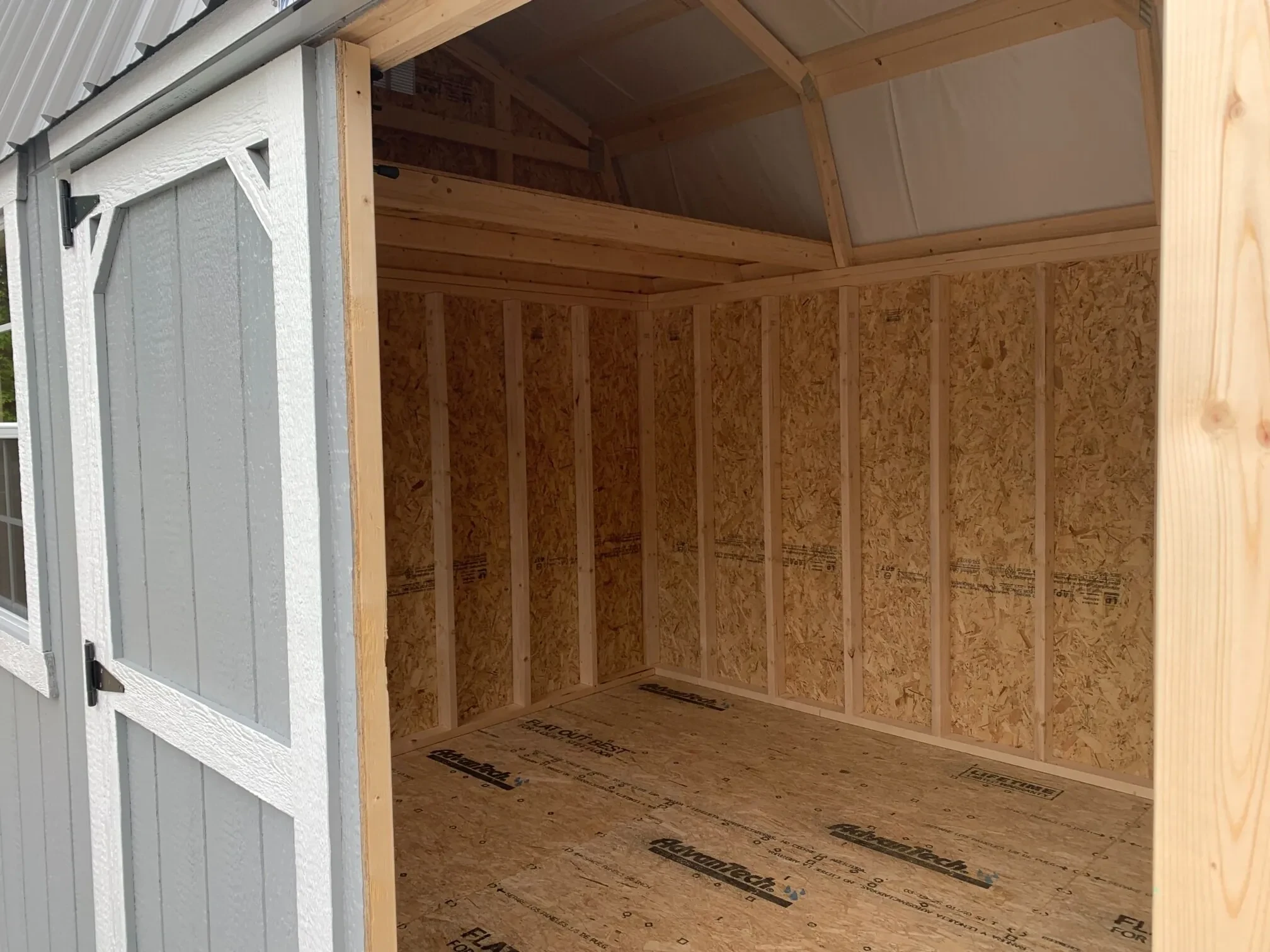 the left side of a side lofted barn with a loft