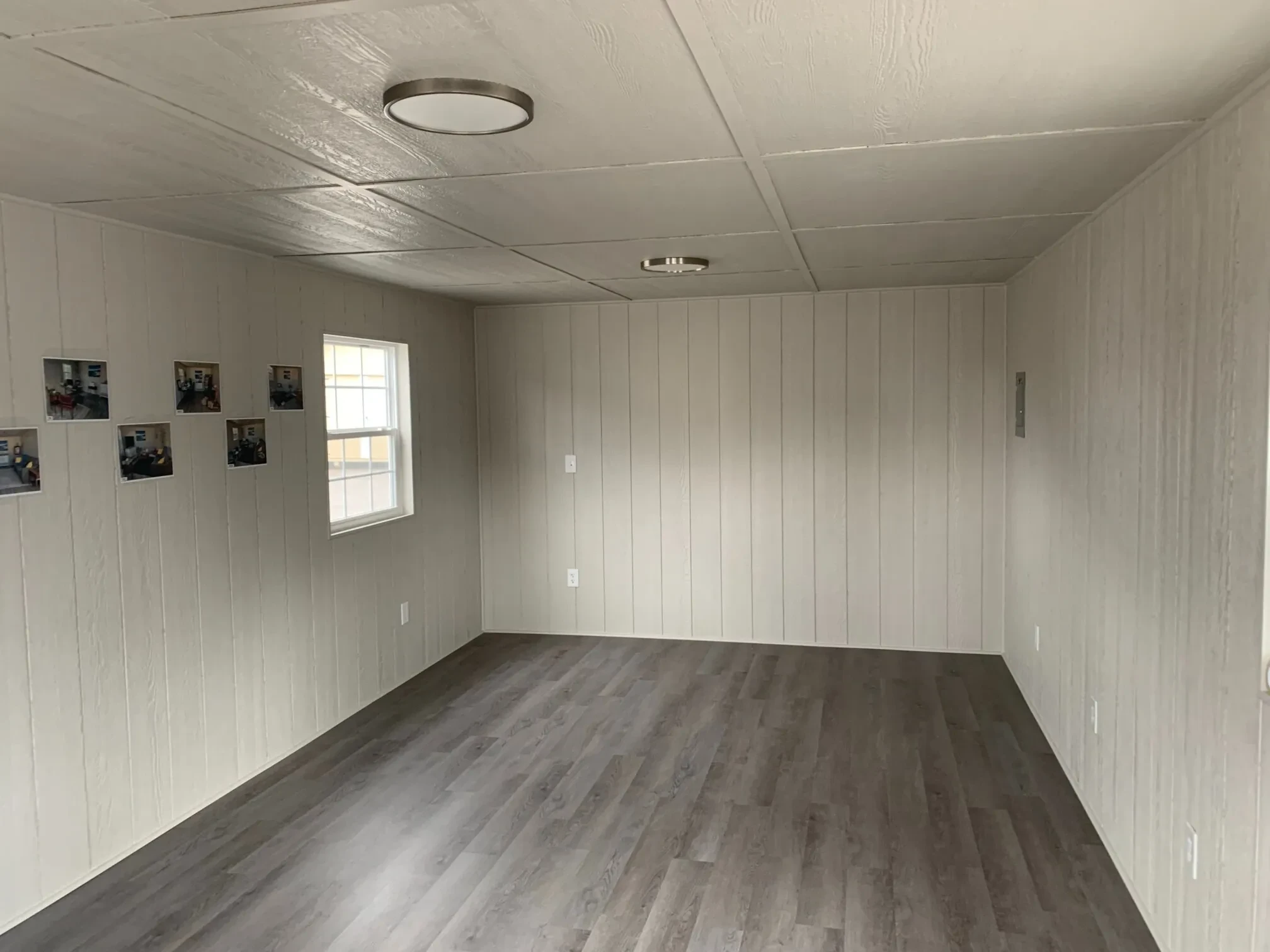 the inside of a shed that is insulated and paneled