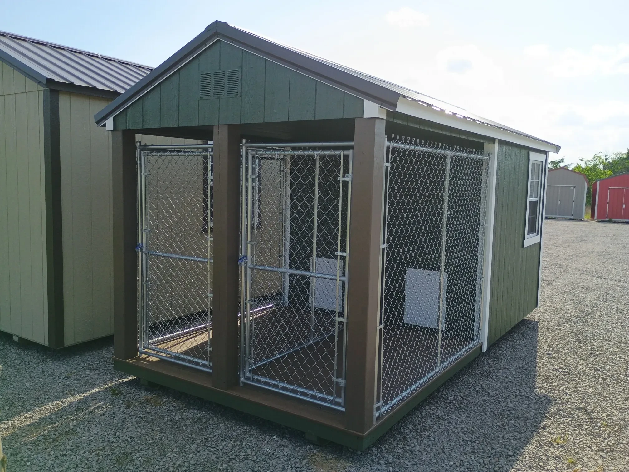 a gg kennel with chain link runs