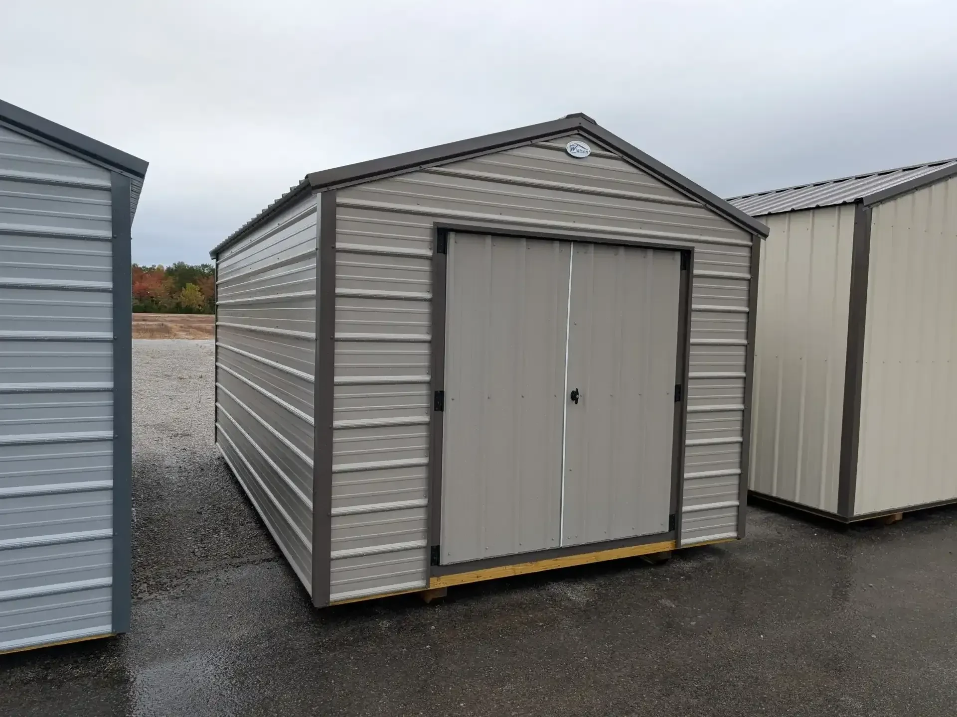 a metal utility shed with double doors