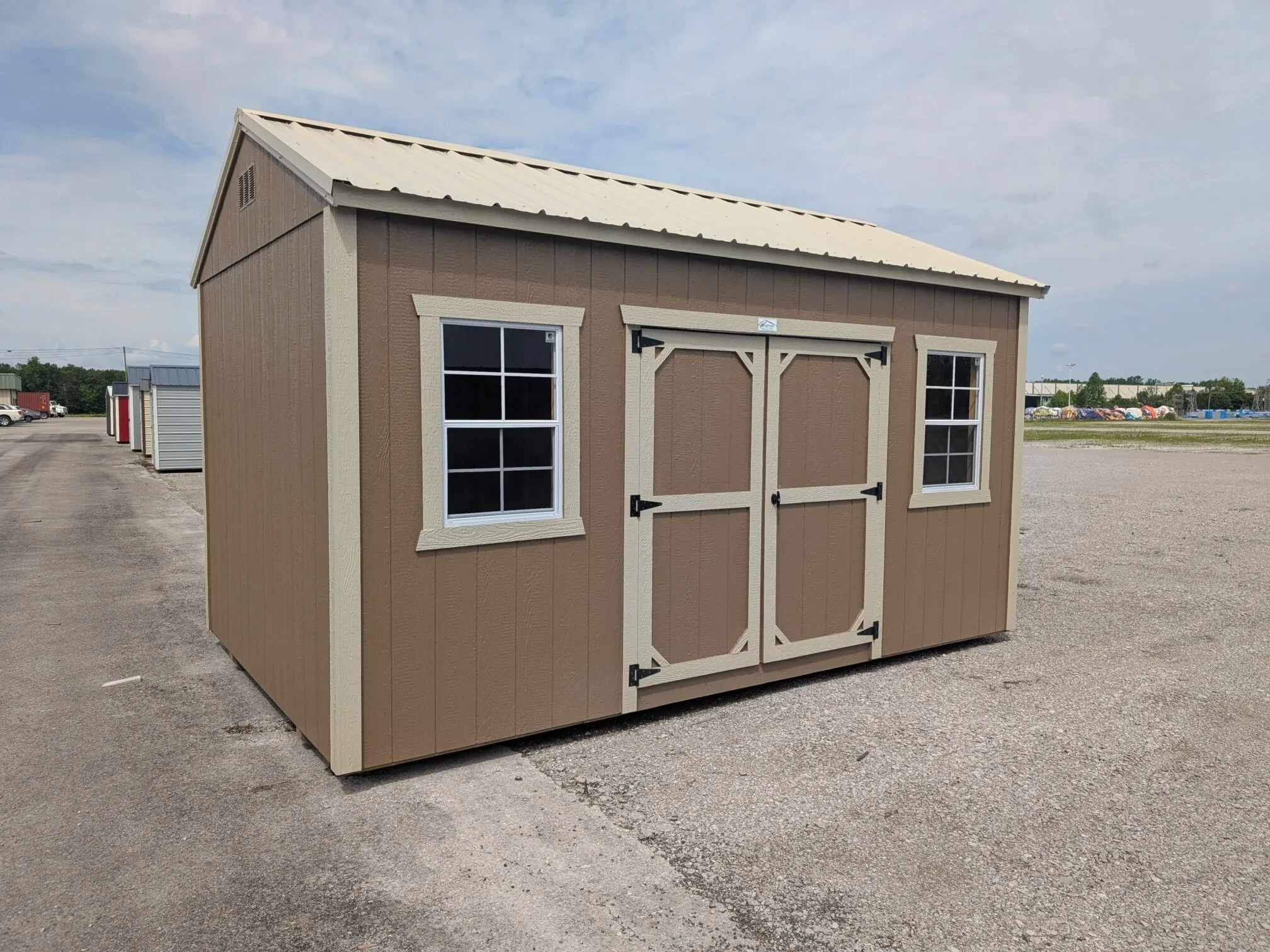 a garden shed with two windows and 72" double doors
