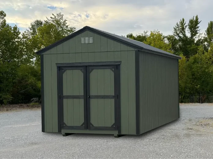 a dark green shed with black trim