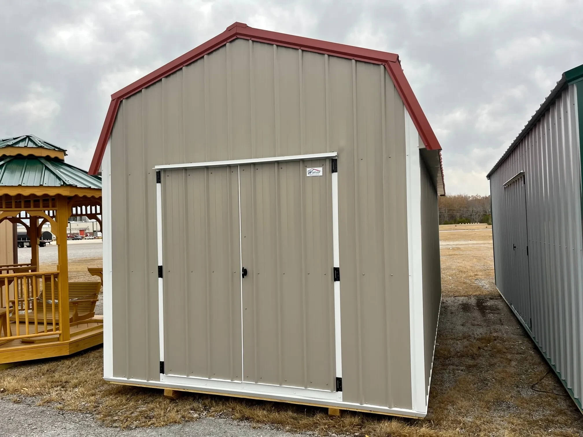 al lofted barn with a red roof